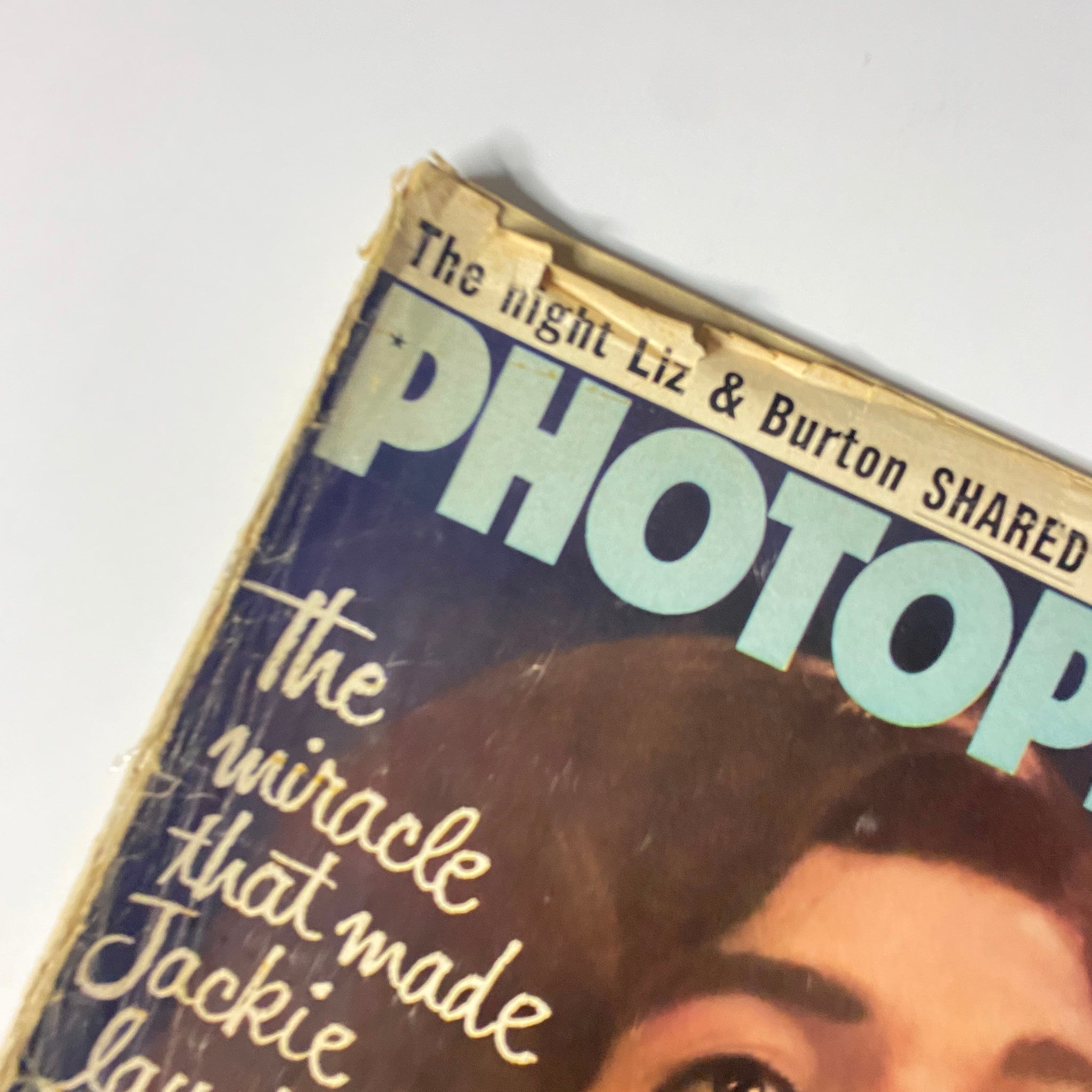 Close-up of the cover of Photoplay Magazine July 1964 Vol 66 No. 1 highlighting Jackie Kennedy and the article title, "The Miracle That Made Jackie Laugh Again."