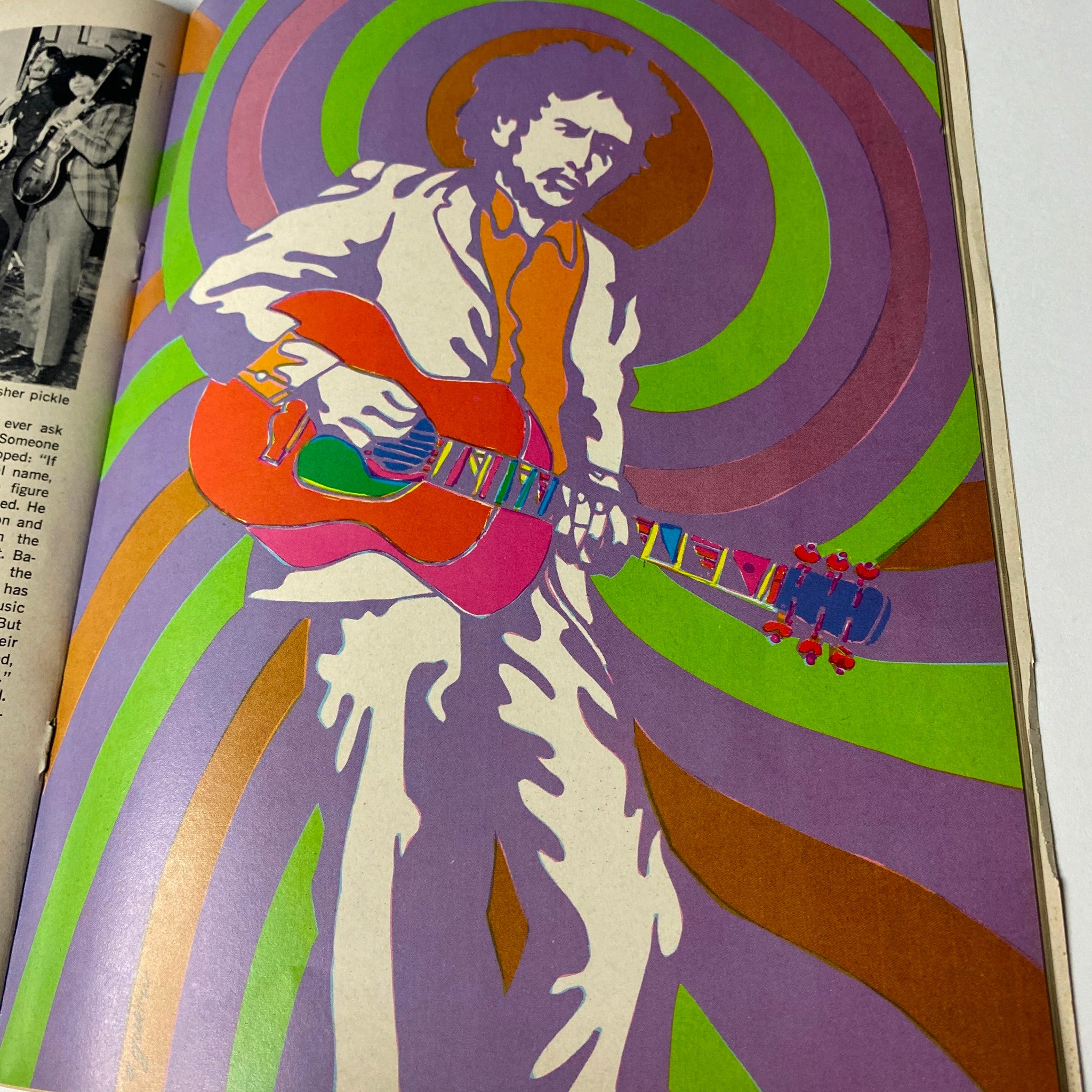 Artwork of a musician with a guitar in colorful psychedelic patterns, from Hullabaloo Magazine May-June 1968, Vol 3 No. 4, capturing the vibrant energy of the music scene.