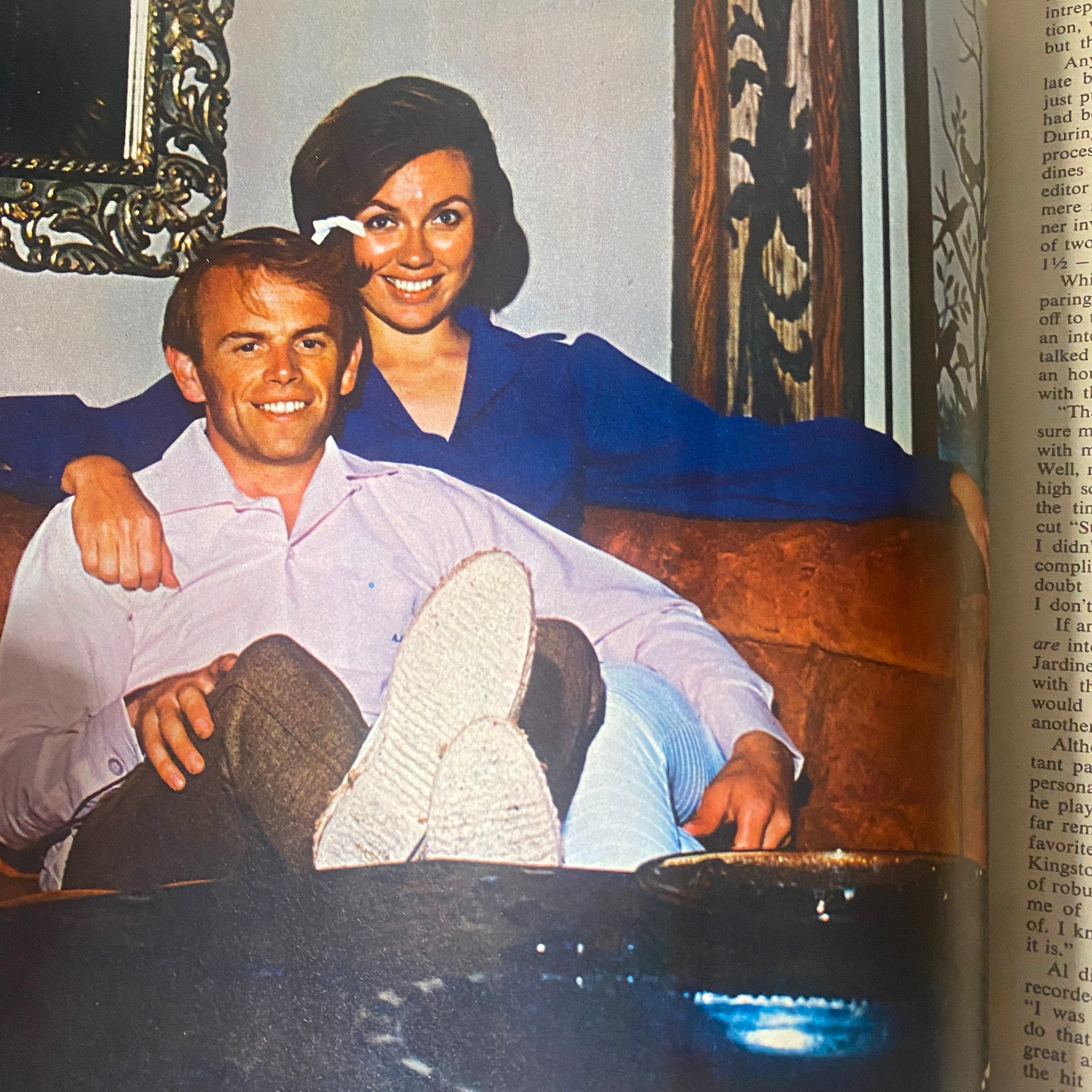 Vintage photograph accompanying Teen Set Magazine November 1966 Vol. 2 No. 6 showcasing a couple relaxing on a couch, reflecting the lifestyle of the 1960s.