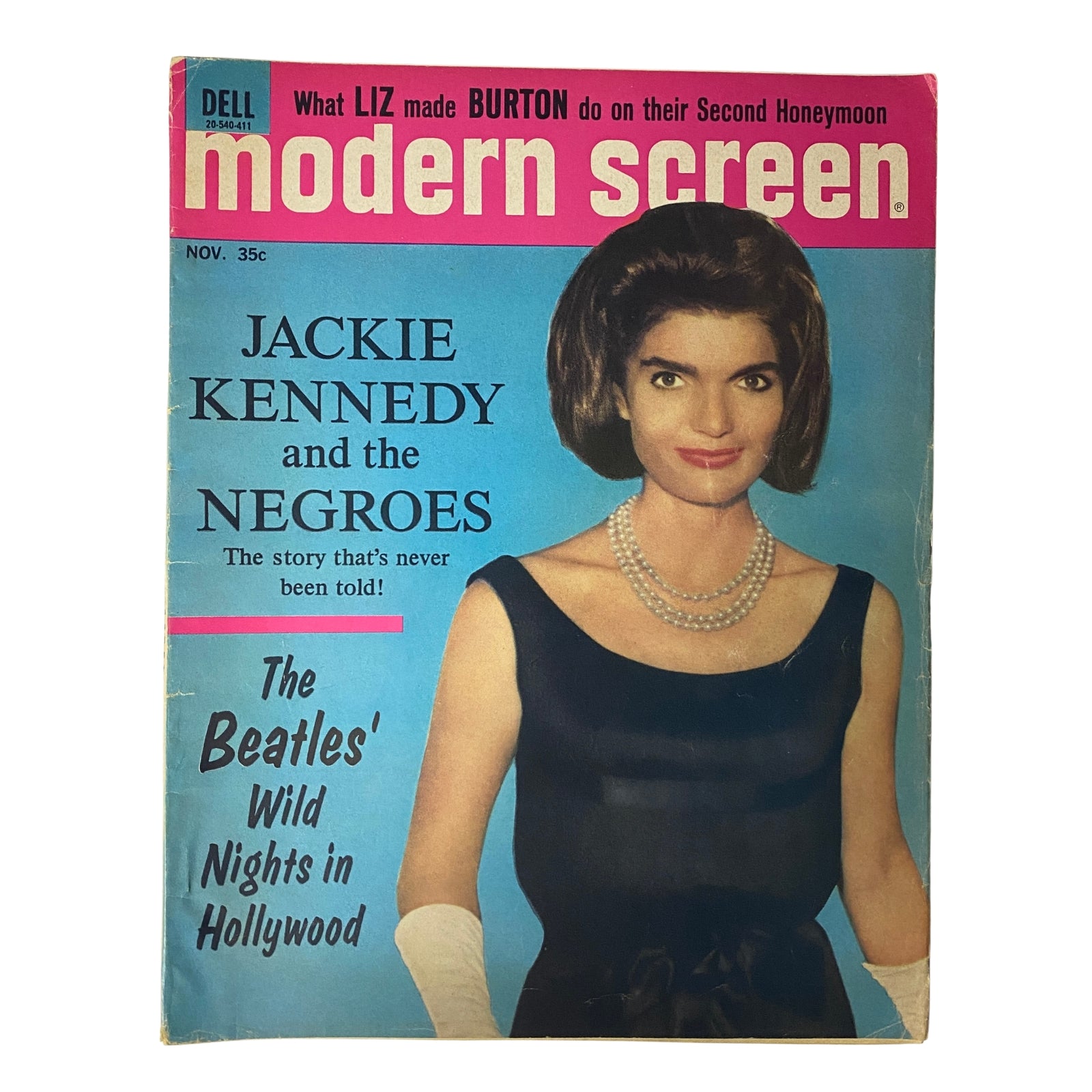 Modern Screen Magazine November 1964 featuring Jackie Kennedy on the cover, showcasing her iconic style. The cover highlights articles including Jackie Kennedy and the Negroes and The Beatles' Wild Nights in Hollywood. A collectible vintage magazine in good condition.