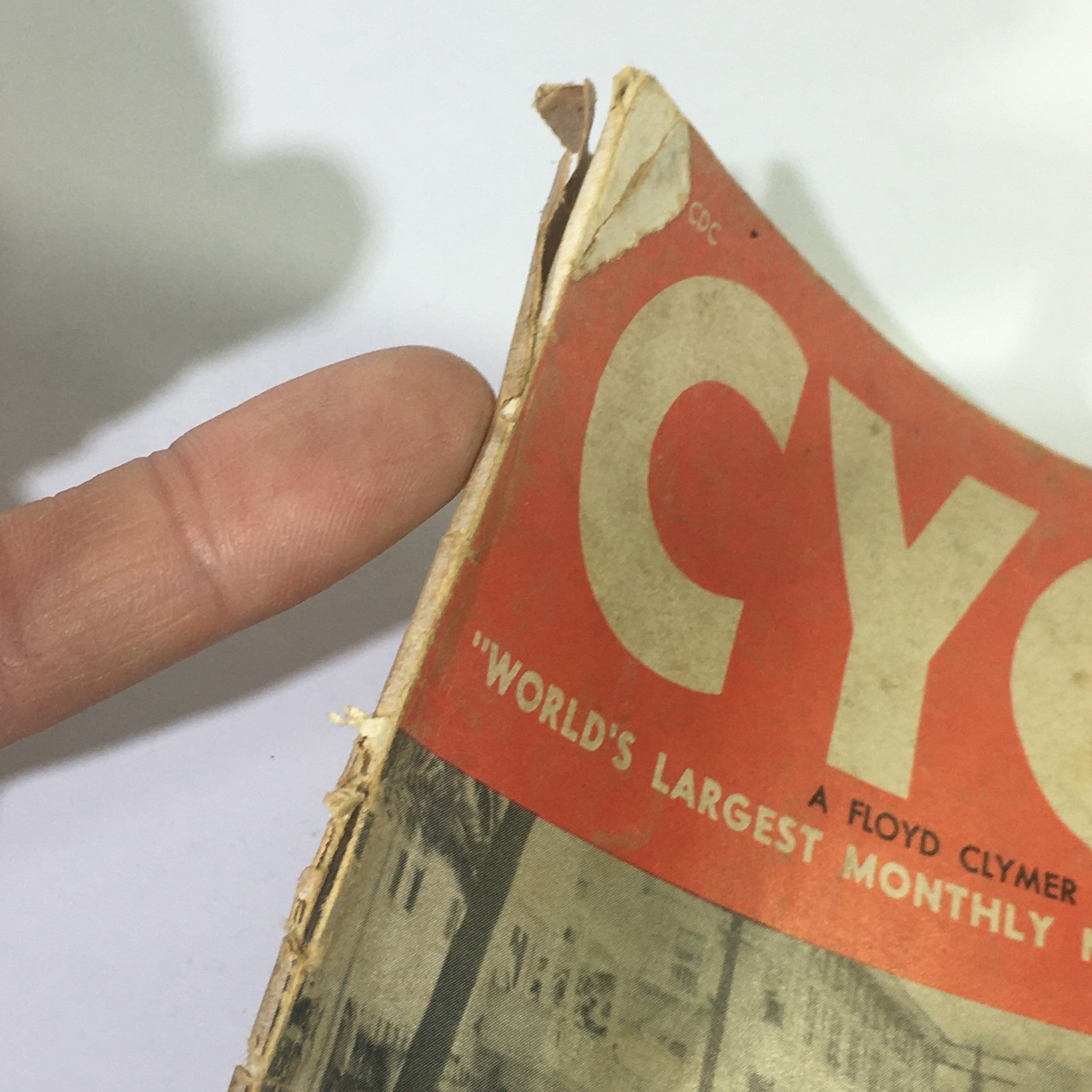 Side view of VTG Cycle Magazine July 1958 showcasing wear and tear on the magazine cover.