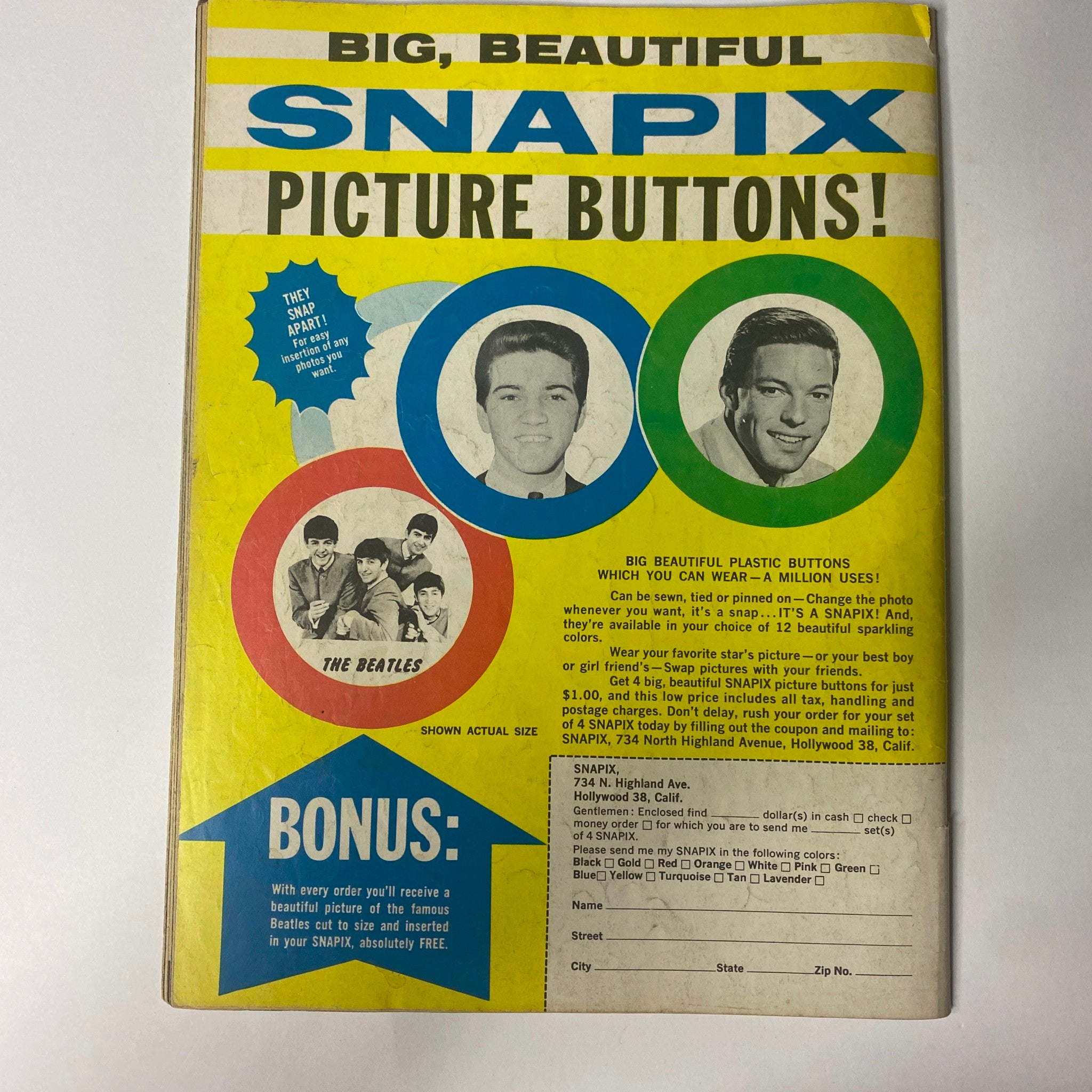 Back cover of Fifteen Magazine July 1964 featuring The Beatles, promoting SNAPIX picture buttons. Colorful design with images of The Beatles, highlighting collectible merchandise related to the magazine issue.