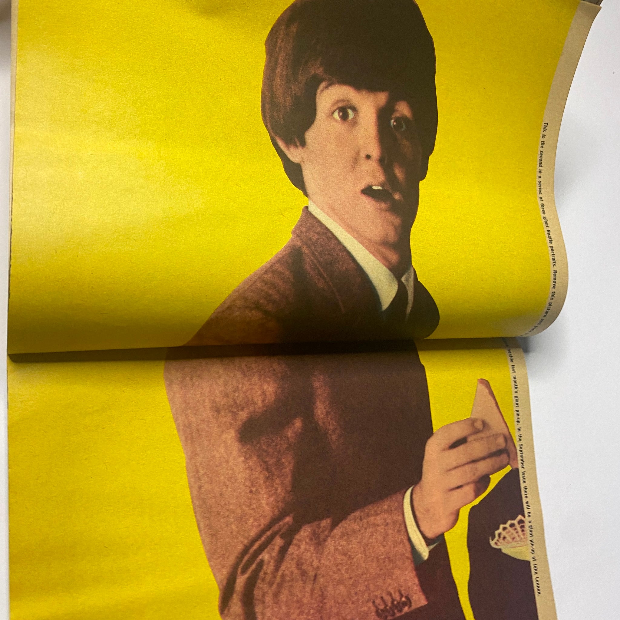 Image featuring Paul McCartney in a playful pose from 16 Magazine August 1965 Vol 7 No. 3, highlighting his iconic 1960s style.