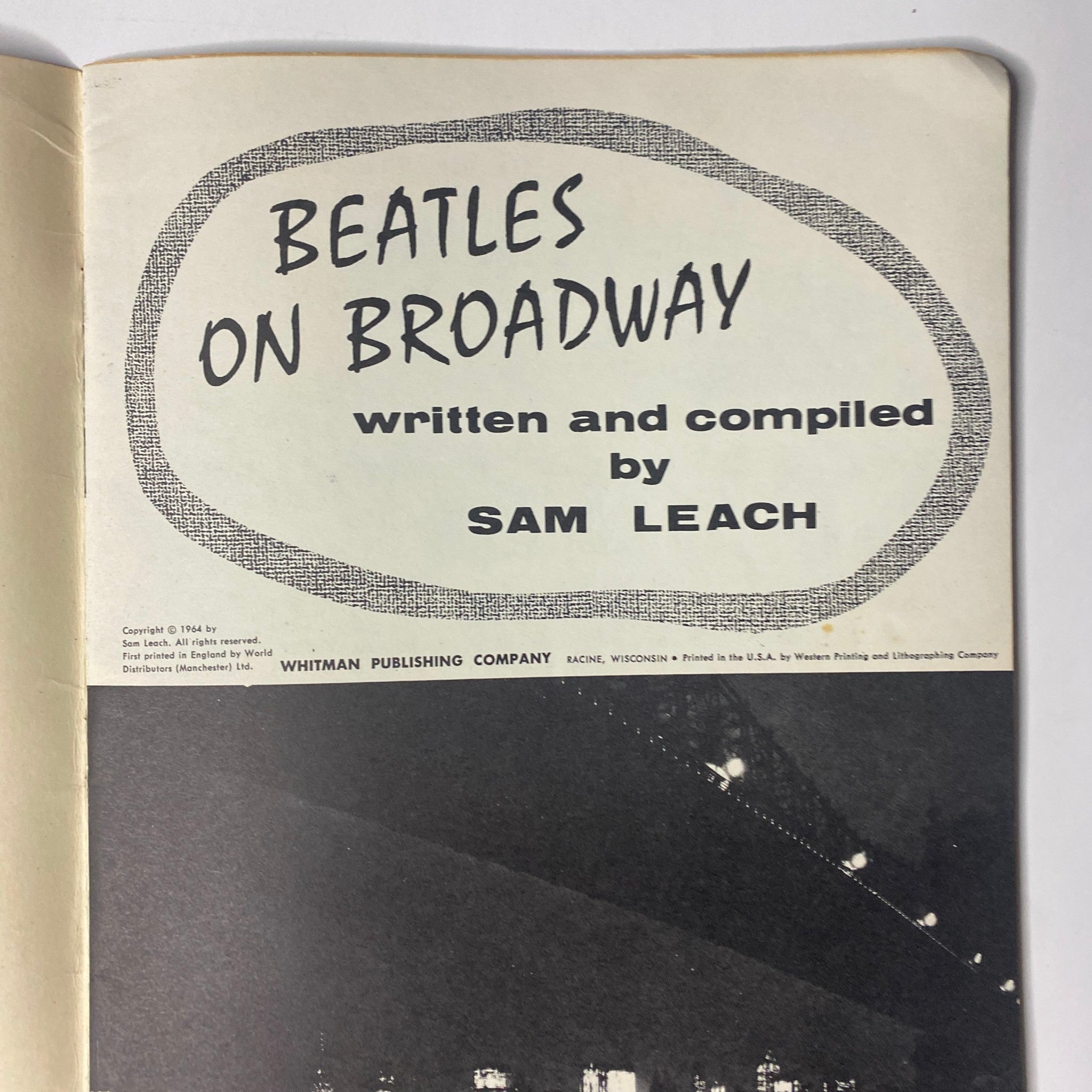 Inside page of '1964 Beatles on Broadway' showcasing the title and author Sam Leach in a bold design.
