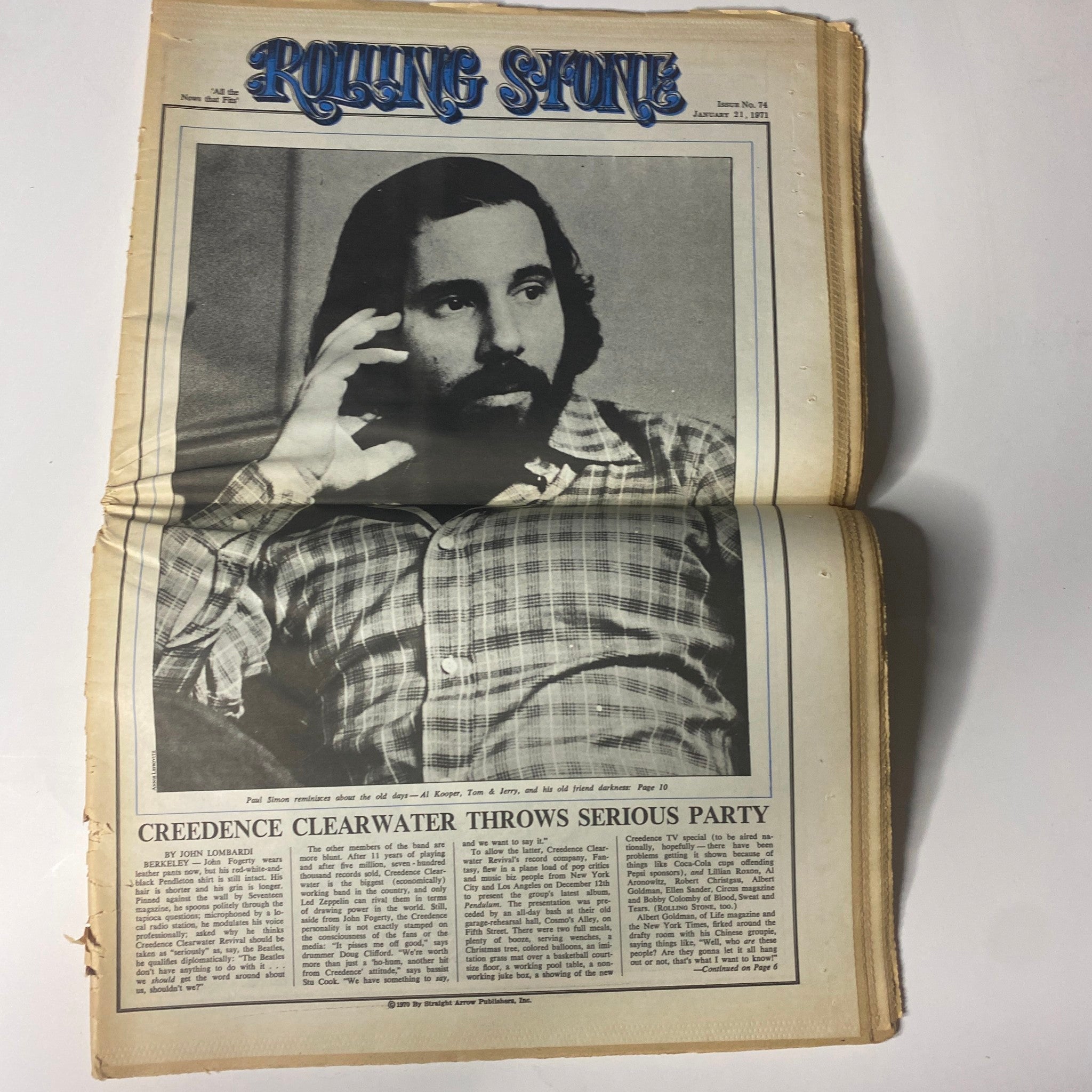 Inside of Rolling Stone Magazine January 21, 1971 featuring a profile of Paul Simon with article titled 'Creedence Clearwater Throws Serious Party'.
