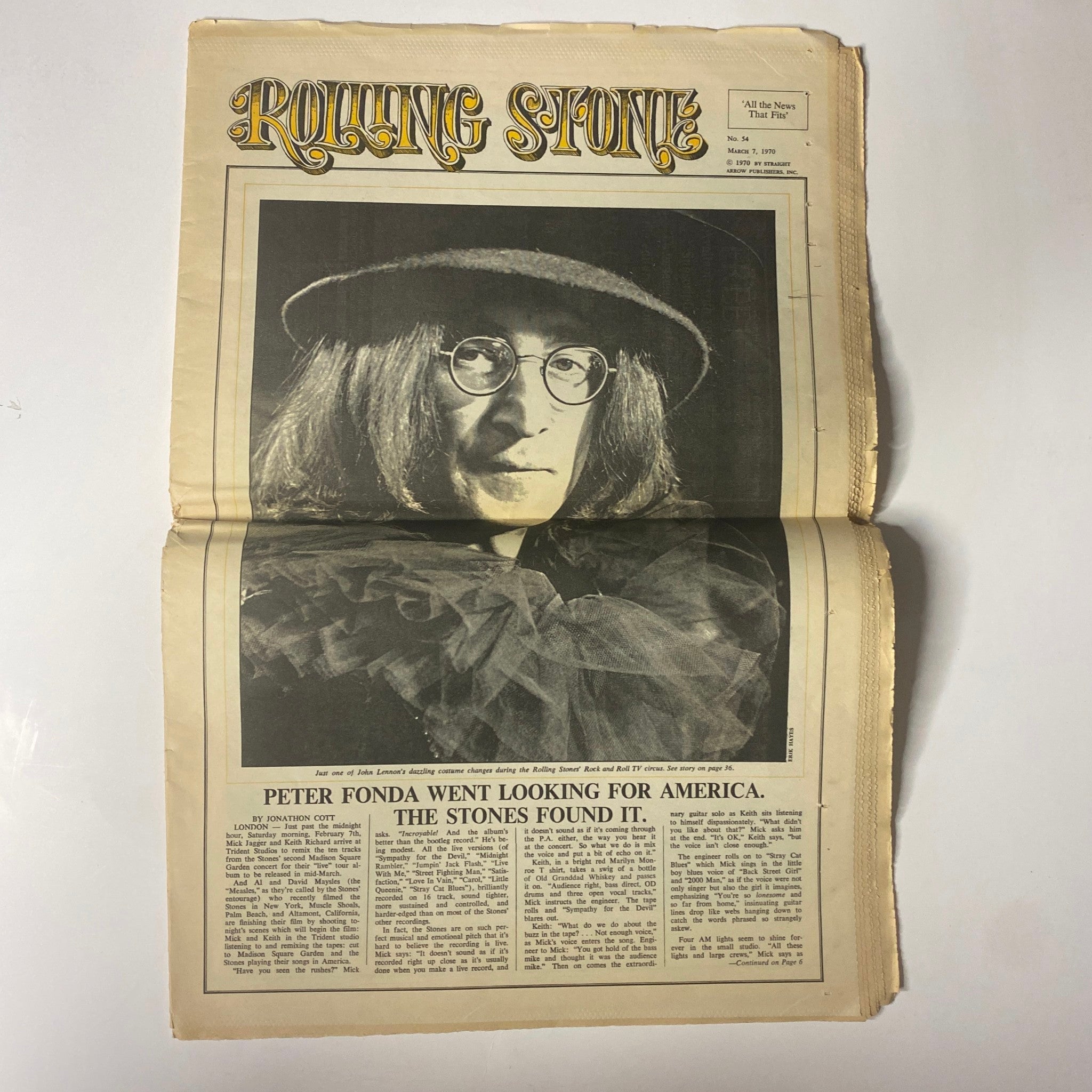 Interior page from Rolling Stone Magazine March 19, 1970 No. 54 with a portrait of a musician in glasses, accompanied by an article titled 'Peter Fonda Went Looking for America. The Stones Found It.'
