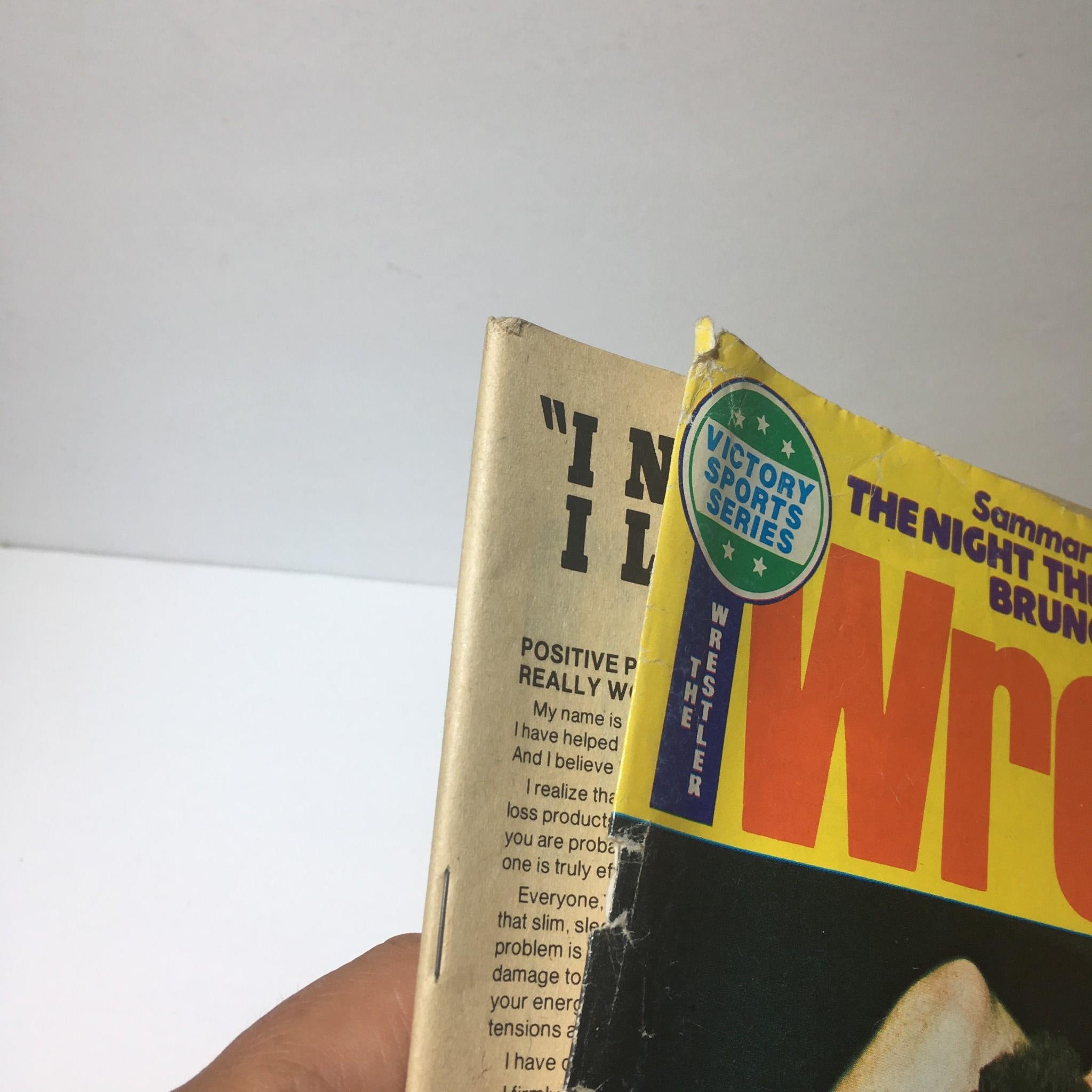 Detail view of the spine section of The Wrestler Magazine December 1976, with a Victory Sports Series sticker visible.
