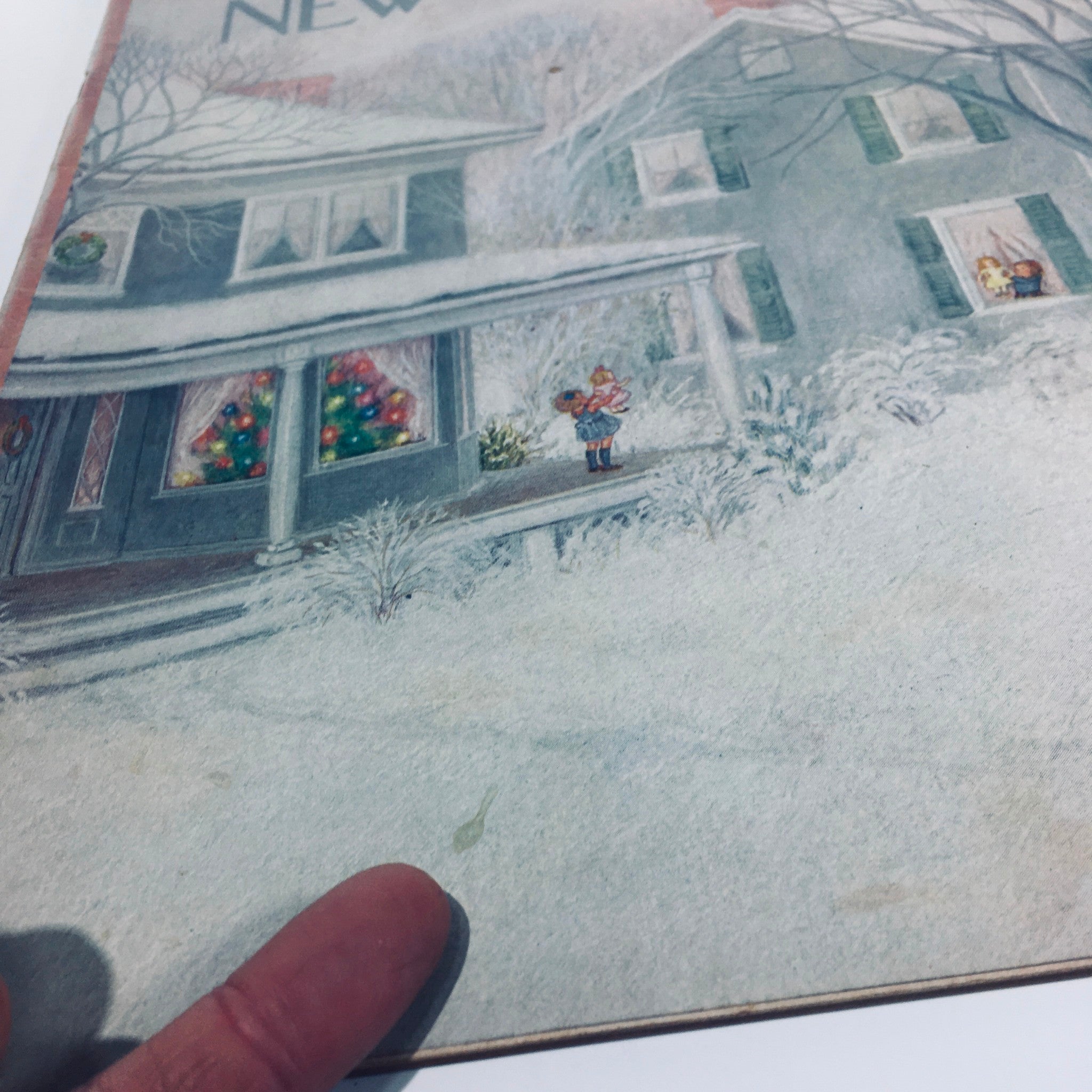 Detailed view of The New Yorker magazine cover from December 27, 1952, featuring a snowy scene with holiday decorations, highlighting the artwork by Edna Eicke.