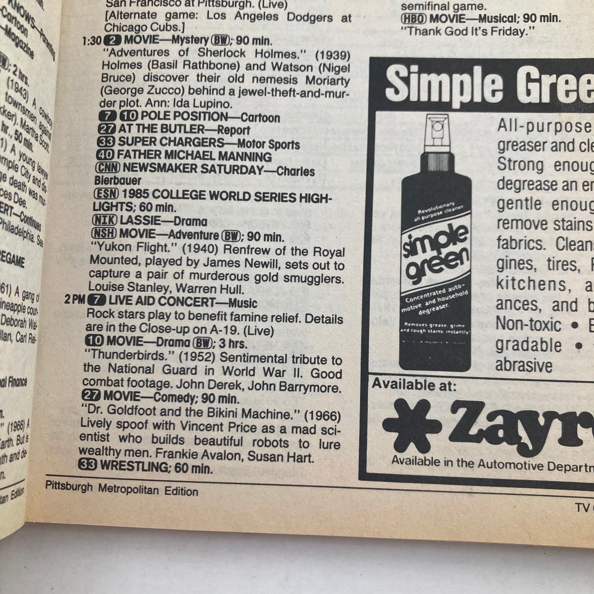 Interior page of TV Guide Magazine from July 13, 1985, showing programming listings and advertisements, including a concentration on the Live Aid Concert.