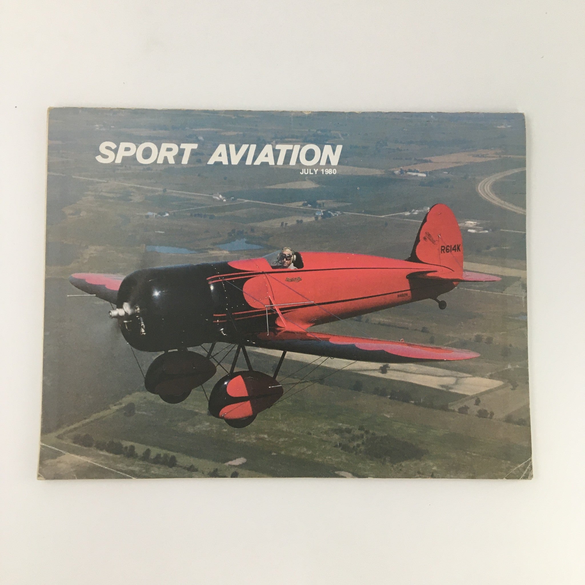 Cover image of Sport Aviation Magazine from July 1980 featuring a red aircraft in flight against a scenic background, highlighting the Rotorway RW-100 Power Plant.