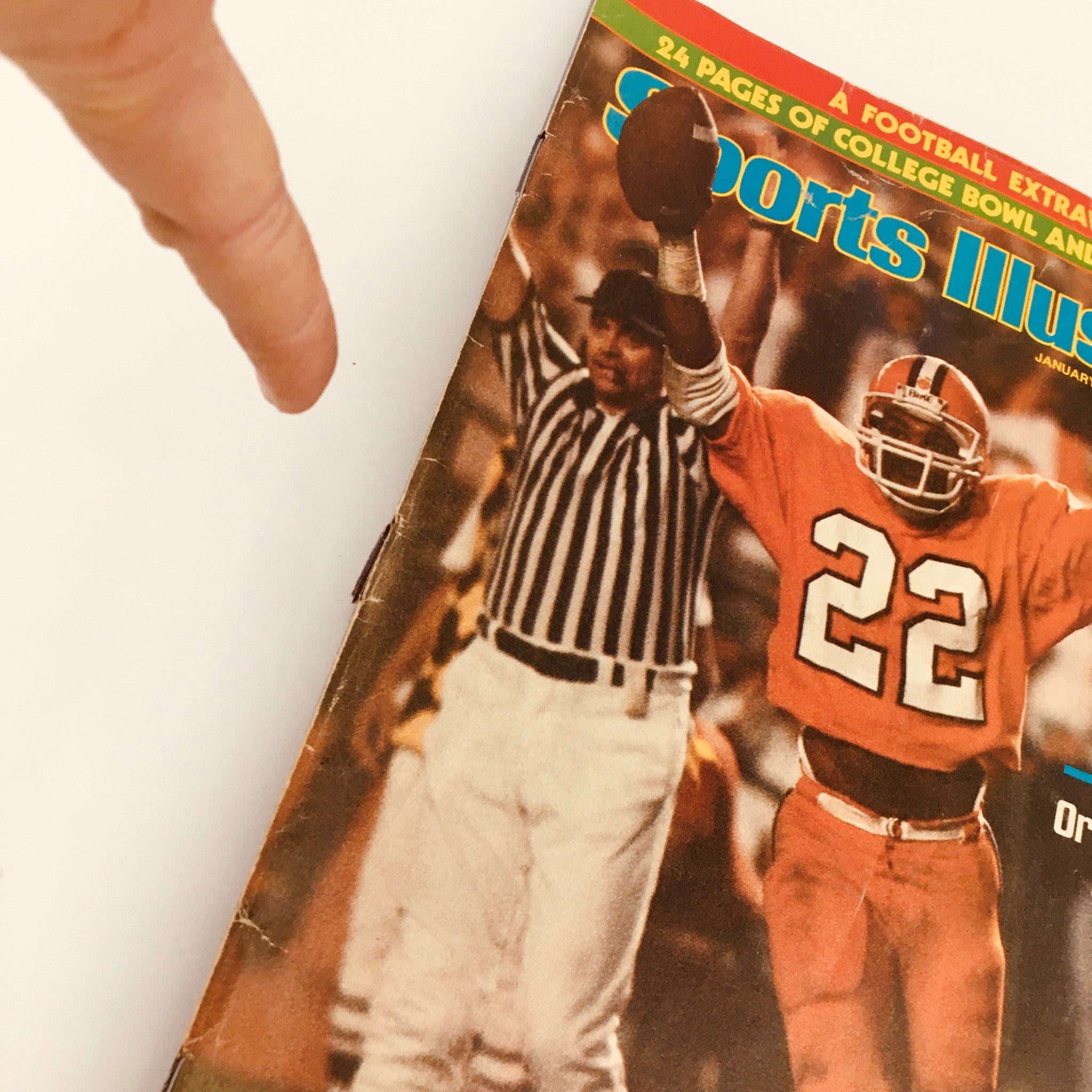 Close-up of the Sports Illustrated Magazine January 11 1982 showing Clemson player Perry Tuttle with referee, highlighting a critical moment in college football.