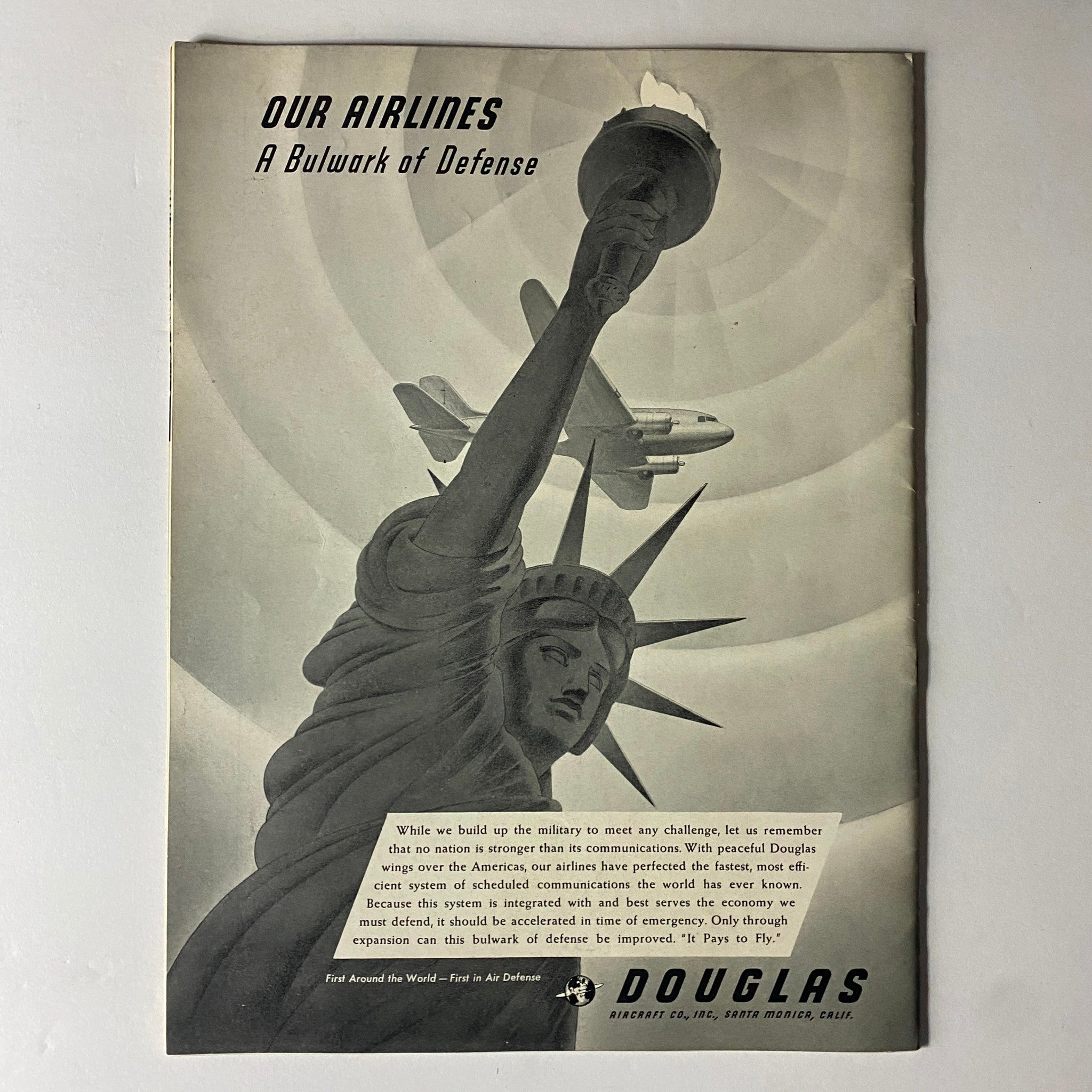 Back cover of Douglas Airview Magazine August 1940 showcasing the Statue of Liberty with an airplane and a message about airlines as a bulwark of defense.