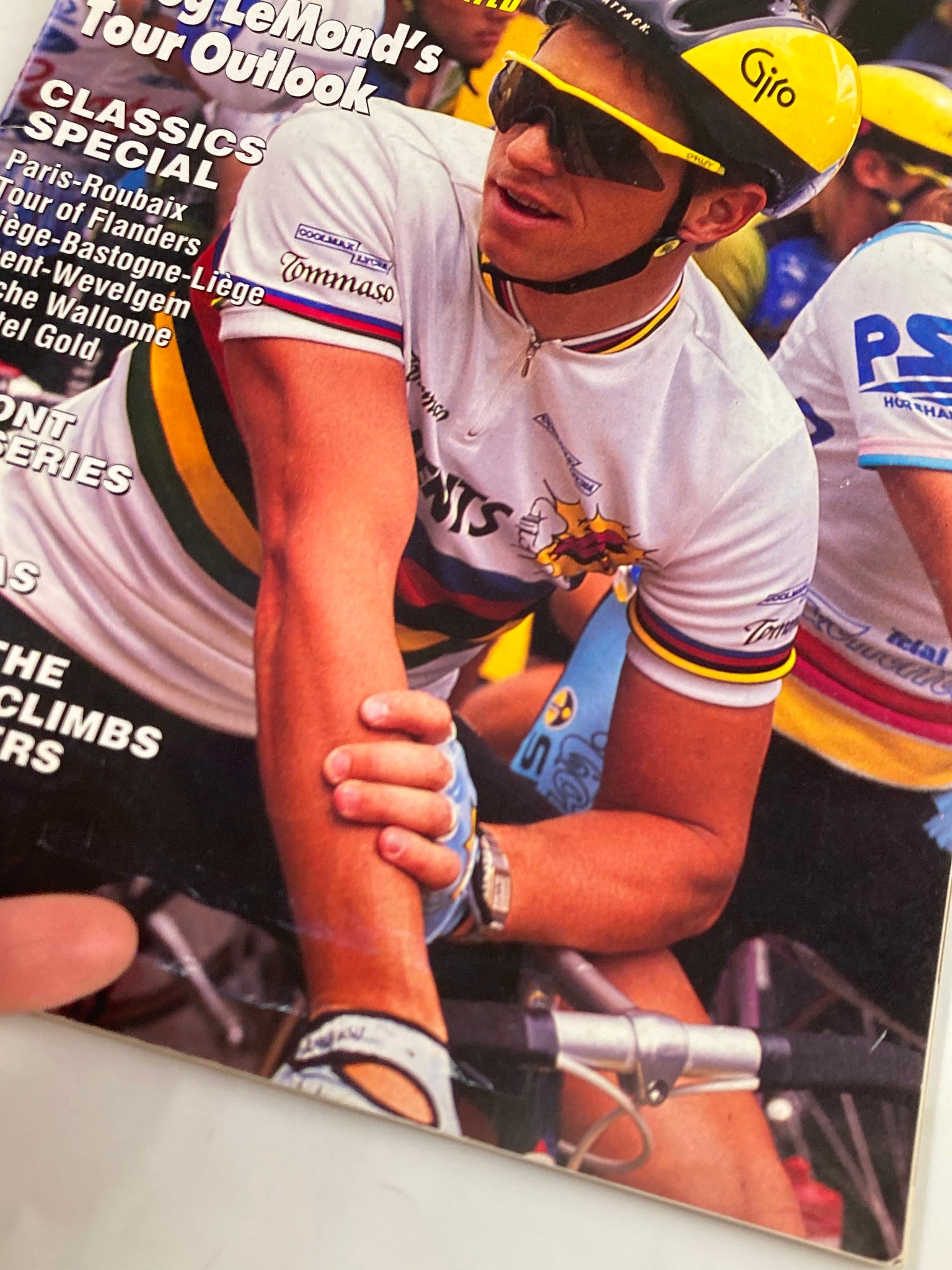Close-up image of the cover of Winning Bicycle Racing Illustrated July 1990 No. 82, highlighting Greg LeMond's Tour Outlook with focus on the detailed cycling attire and competitive atmosphere.