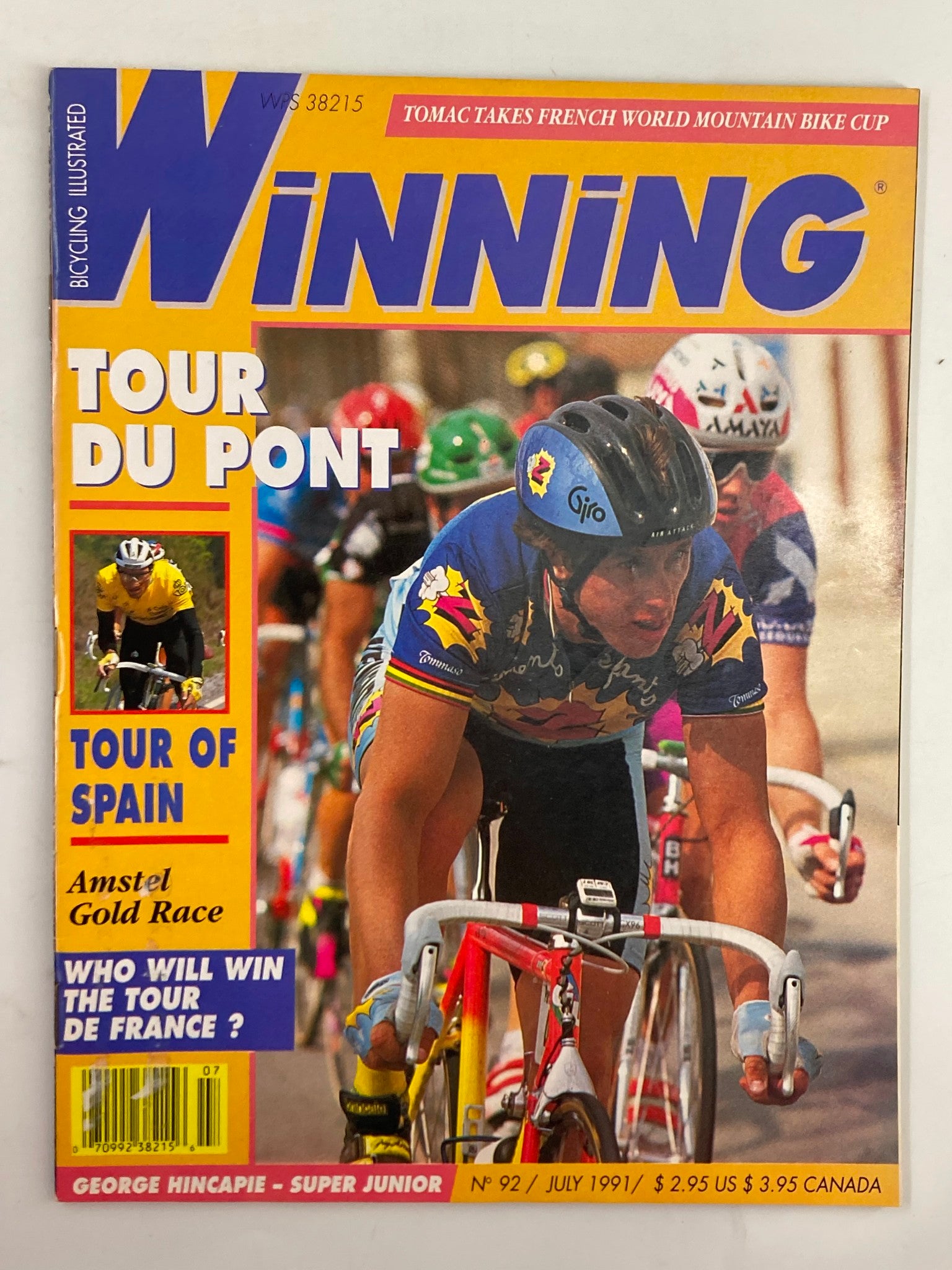 Cover of Winning Bicycle Racing Illustrated magazine from July 1991, featuring competitive cyclists in action with vibrant colors, highlighting the Tour du Pont and Tour of Spain events. This issue (#92) includes renowned cyclists Greg LeMond and Johan Bruyneel, making it a valuable piece for cycling enthusiasts.