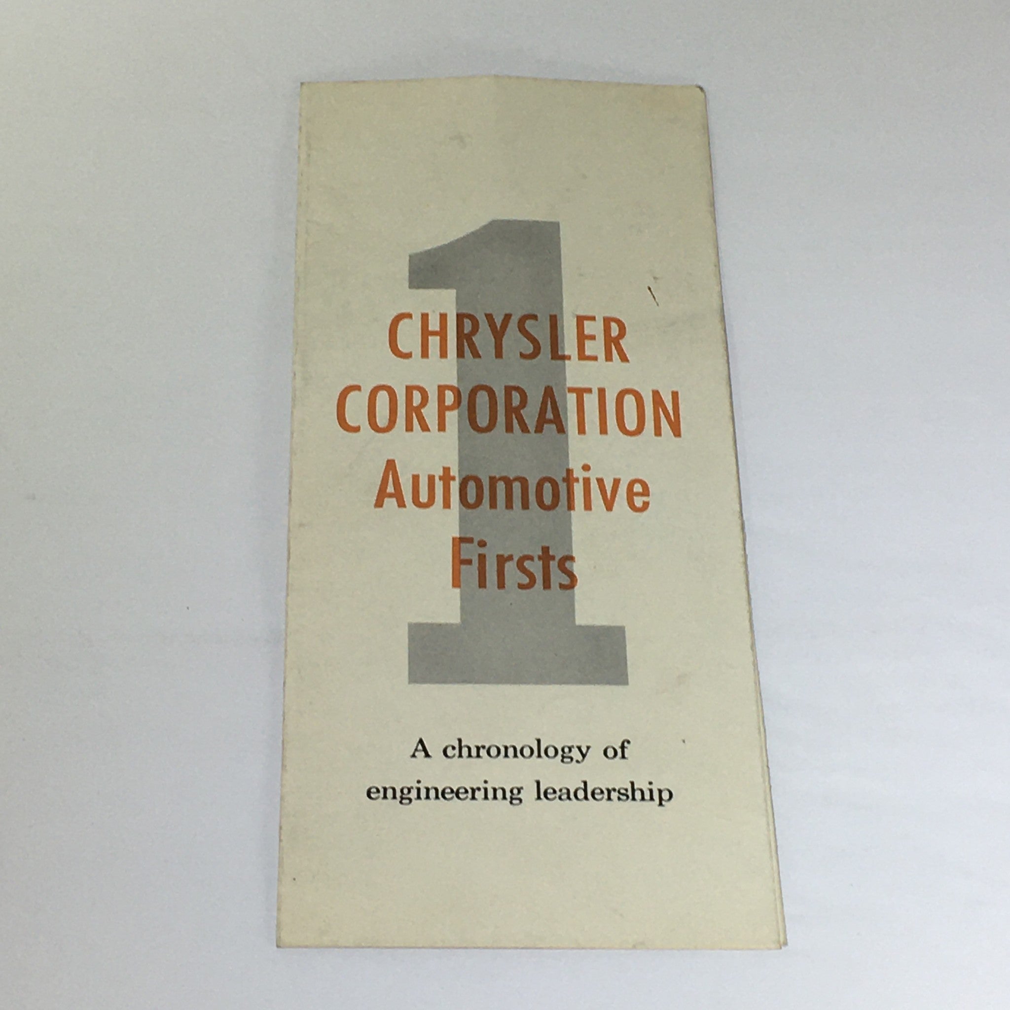 Cover of Vintage Chrysler Corporation Automotive Firsts 1924 - 1946 Models Car Catalog featuring the title 'Chrysler Corporation Automotive Firsts' and minimalistic design.