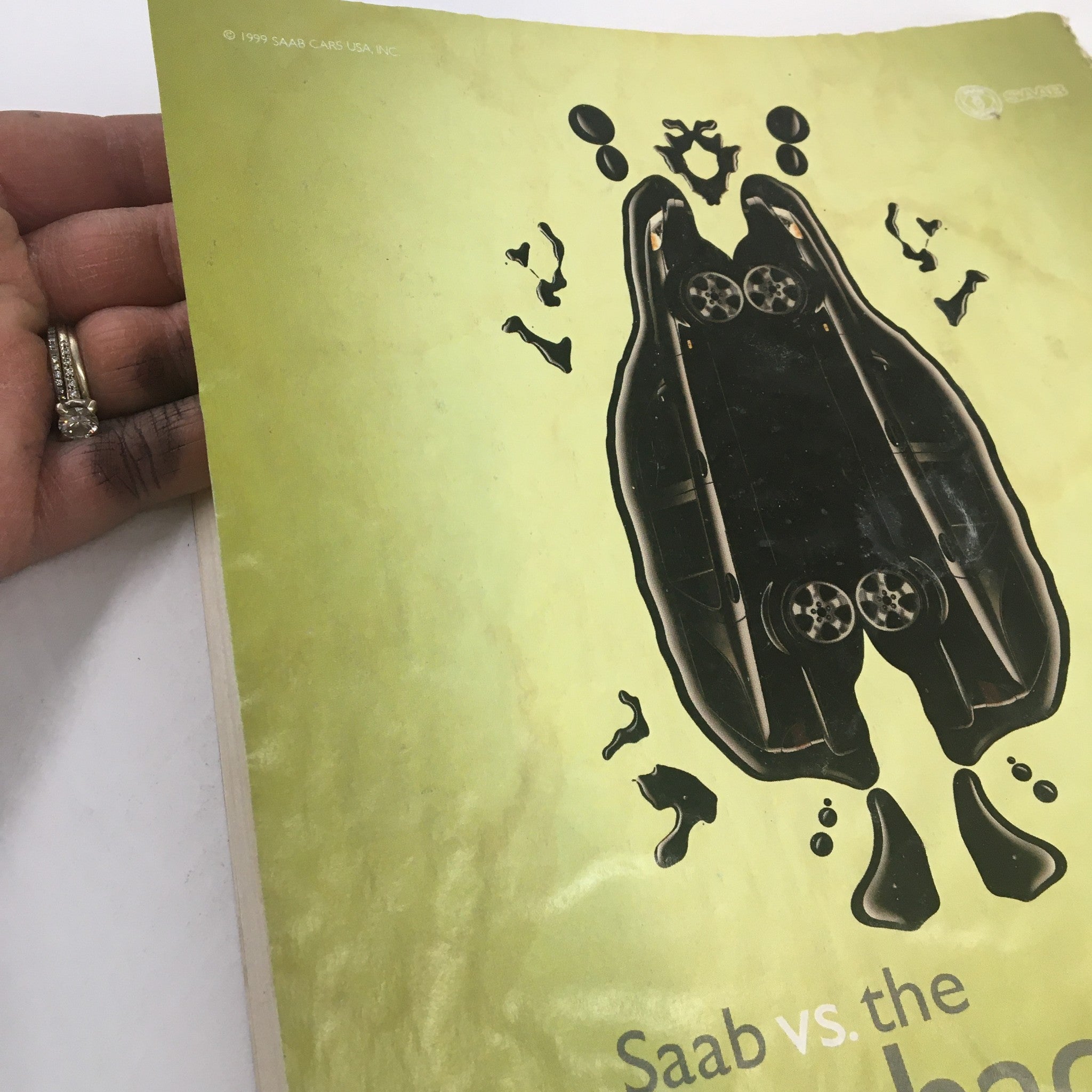 Close-up of the Saab advertisement in The New Yorker, emphasizing the Rorschach test imagery, inviting viewers to interpret the message. Title: The New Yorker Full Magazine June 14 1999 Family Portrait by William Steig.