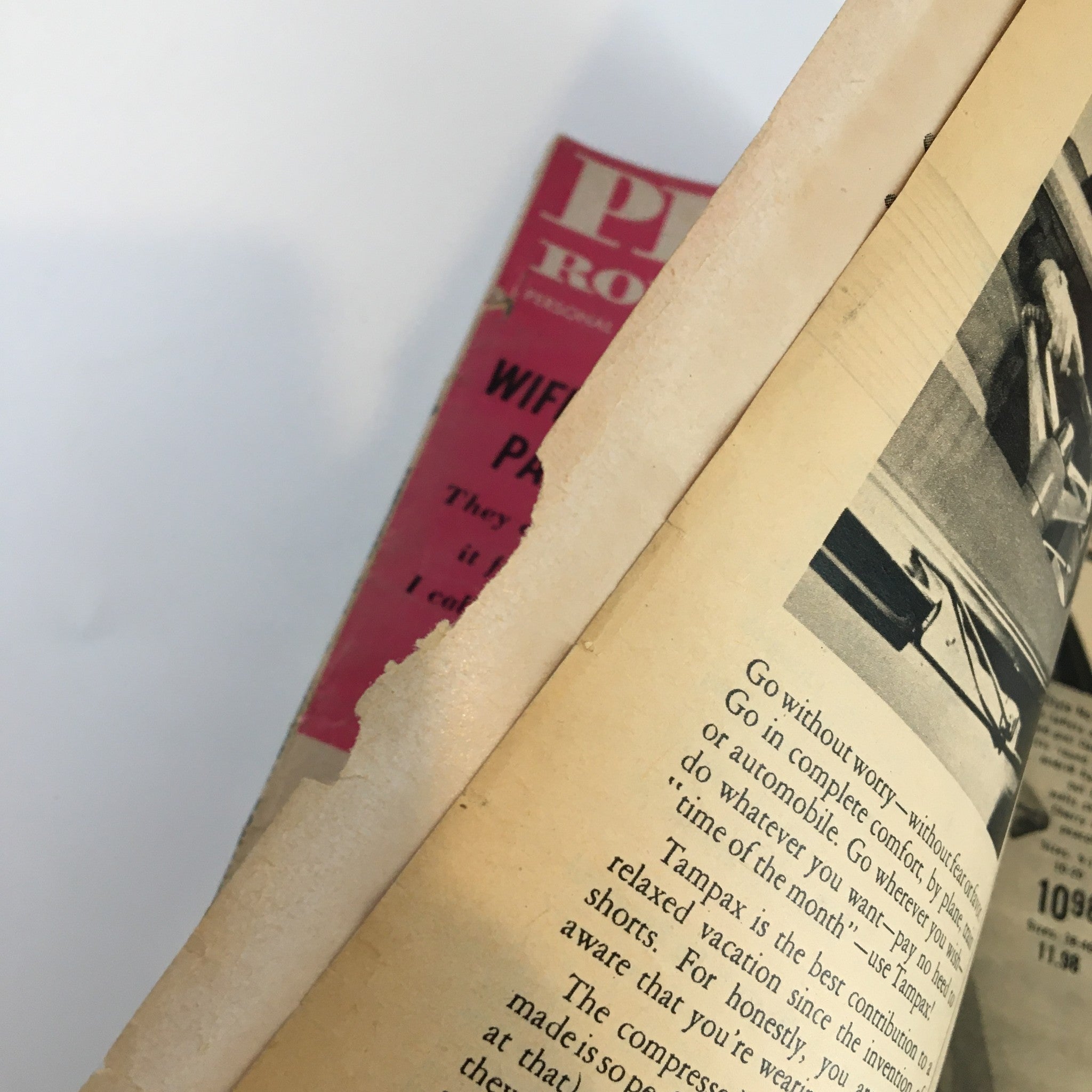 Close-up of the spine of Personal Romances Magazine September 1956, highlighting wear and a visible tear, indicative of vintage condition.