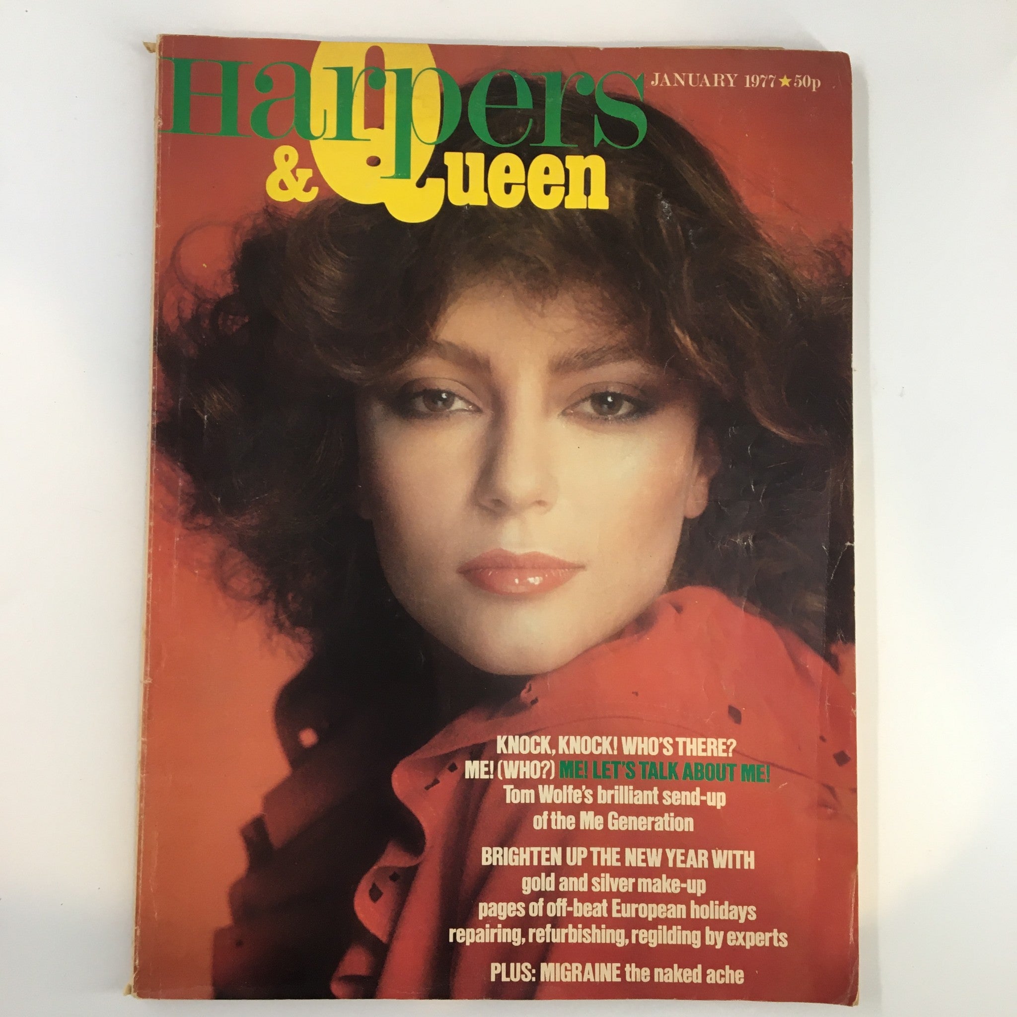 Vintage Harpers & Queen Magazine January 1977 featuring a woman with bold makeup and curly hair, highlighting the Me Generation theme and Tom Wolfe's insights, ideal for collectors and vintage media enthusiasts.