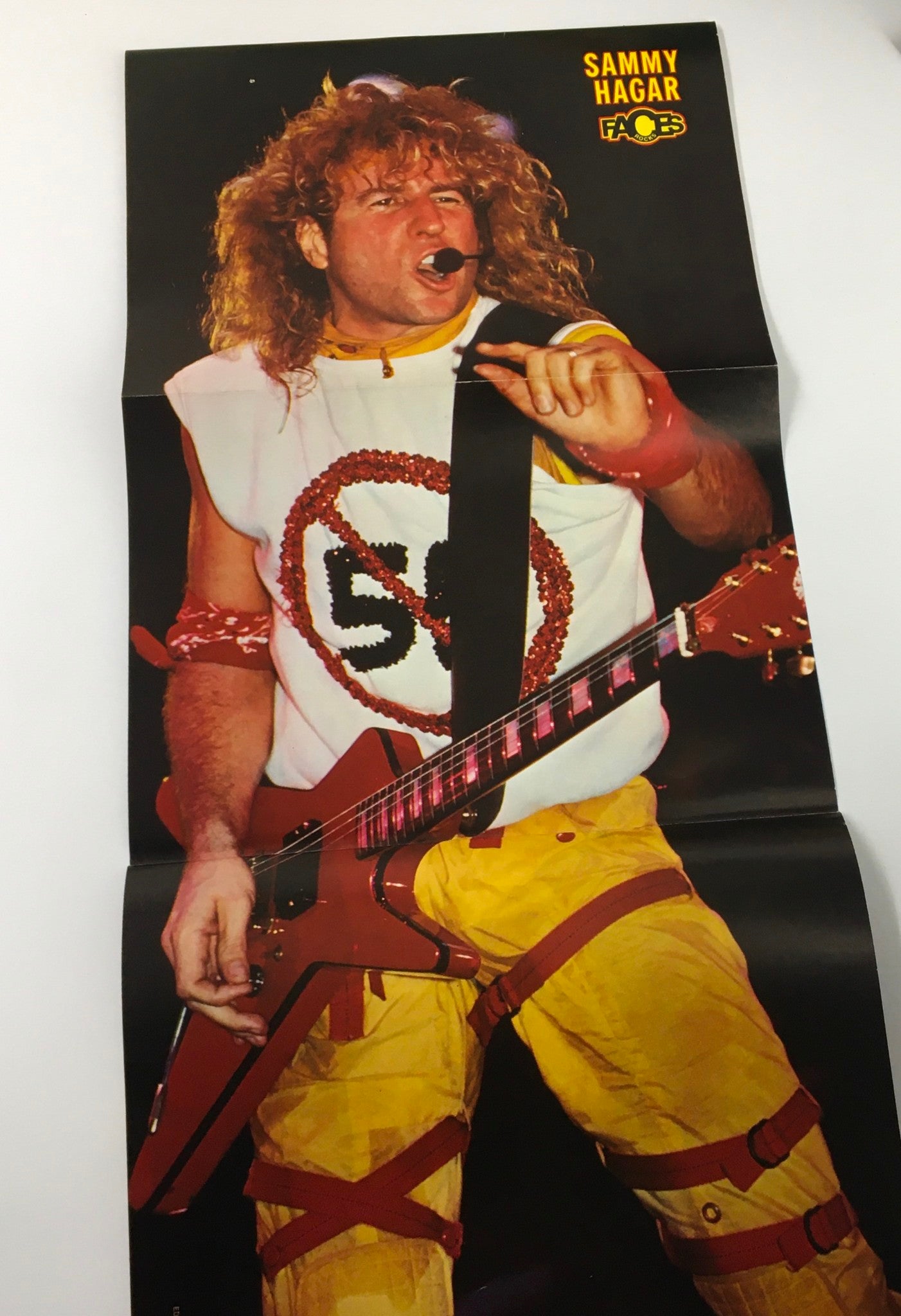 Fold-out poster of Sammy Hagar from the Faces Rocks Magazine March 1985, capturing his energetic performance style.