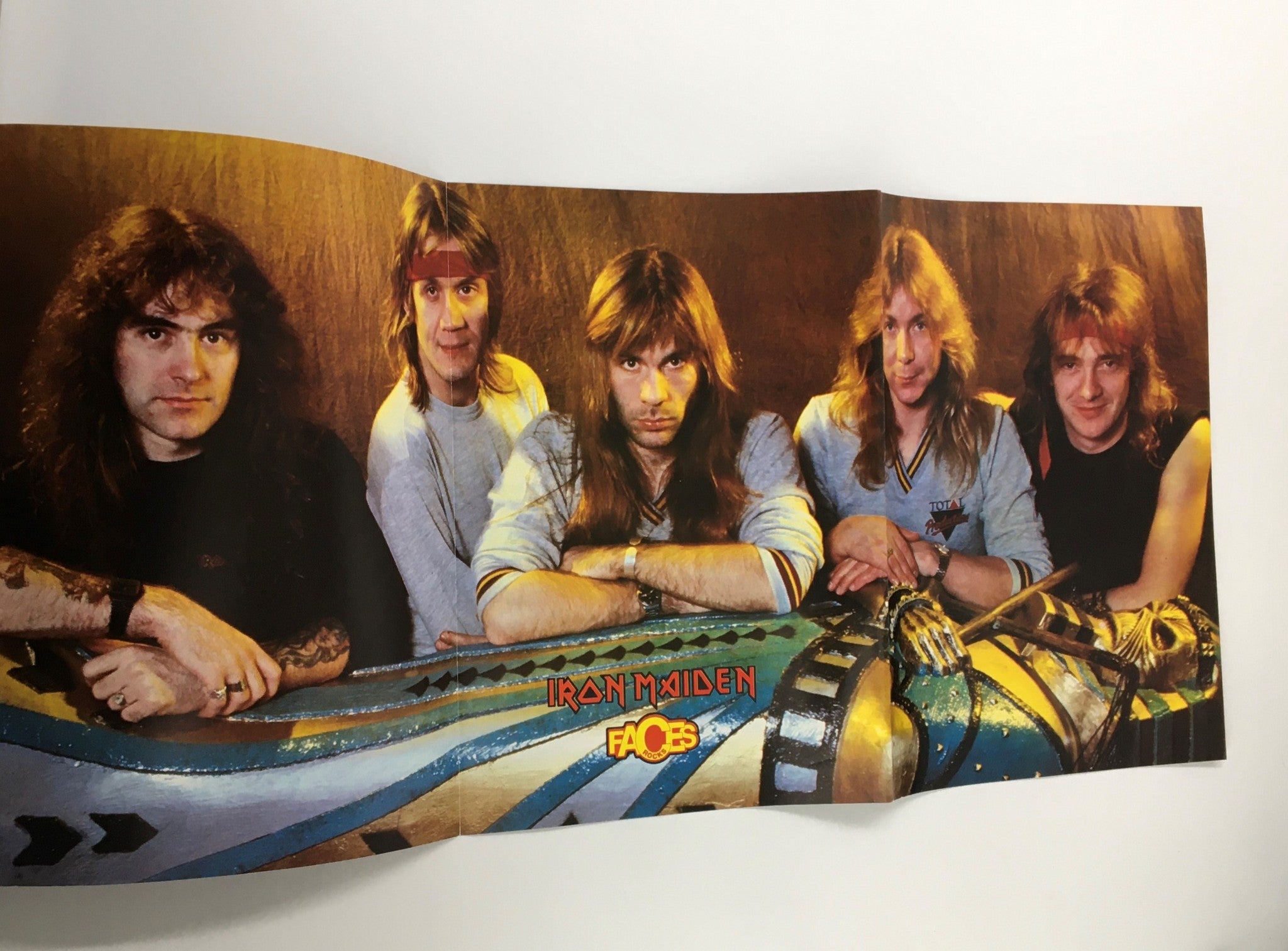 Fold-out poster of the band Iron Maiden from the Faces Rocks Magazine March 1985, featuring the iconic heavy metal group in a classic lineup.
