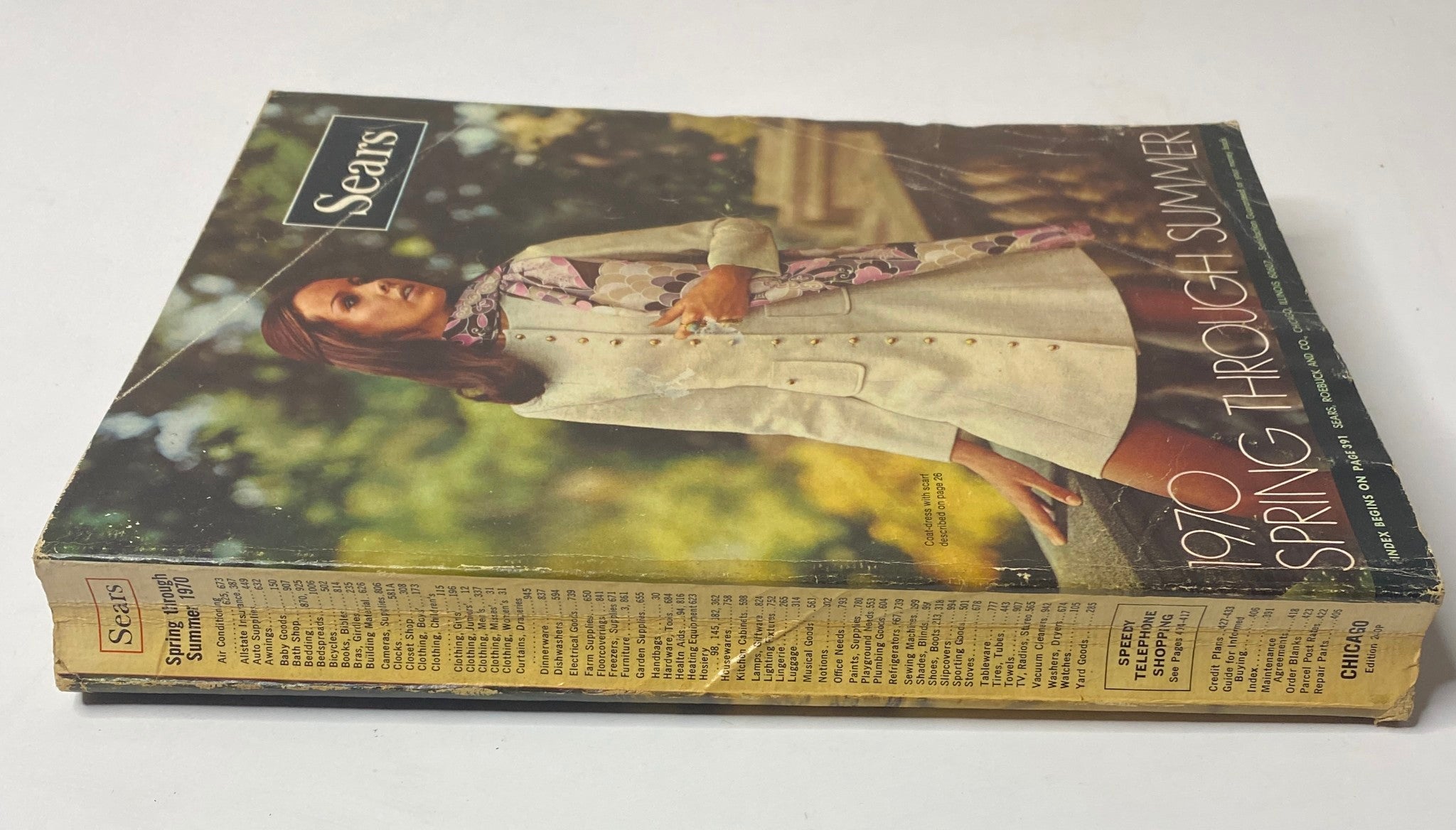 Cover of the 1970 Sears, Roebuck and Co. Spring and Summer Catalog featuring a model in a stylish coat, showcasing retro fashion trends of the era.