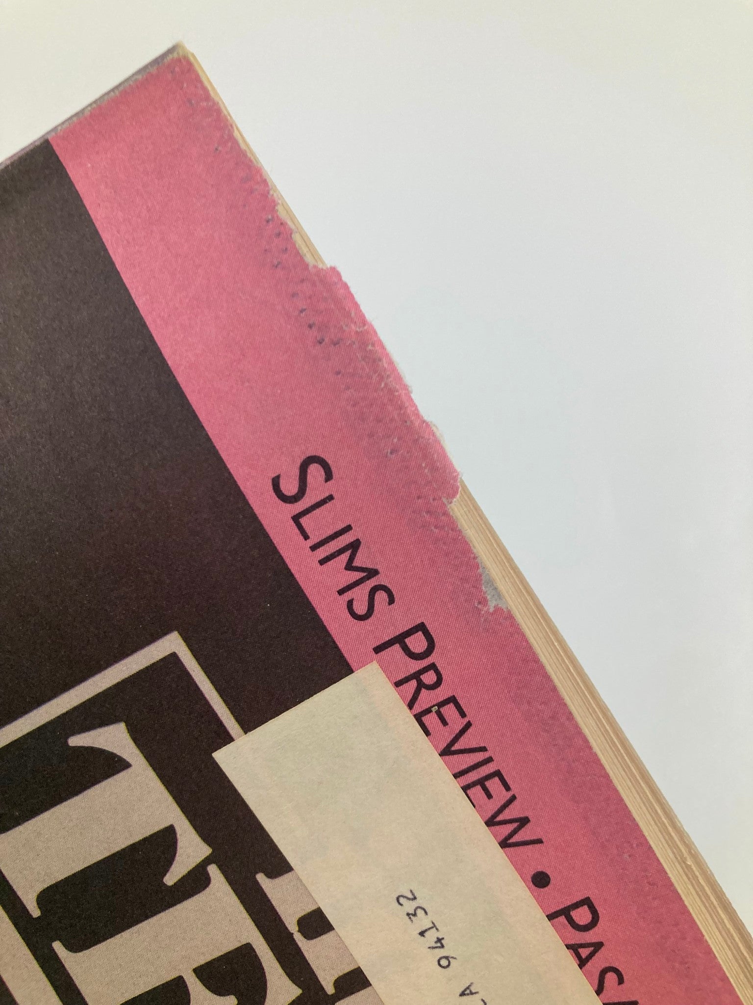 Close-up of the edge of Inside Tennis Magazine March 1989 displaying wear and a notable address label, indicative of its authenticity as a collectible. This issue, titled 'The Chris and Martina Show Goes On', features legendary tennis players Chris Evert and Martina Navratilova.