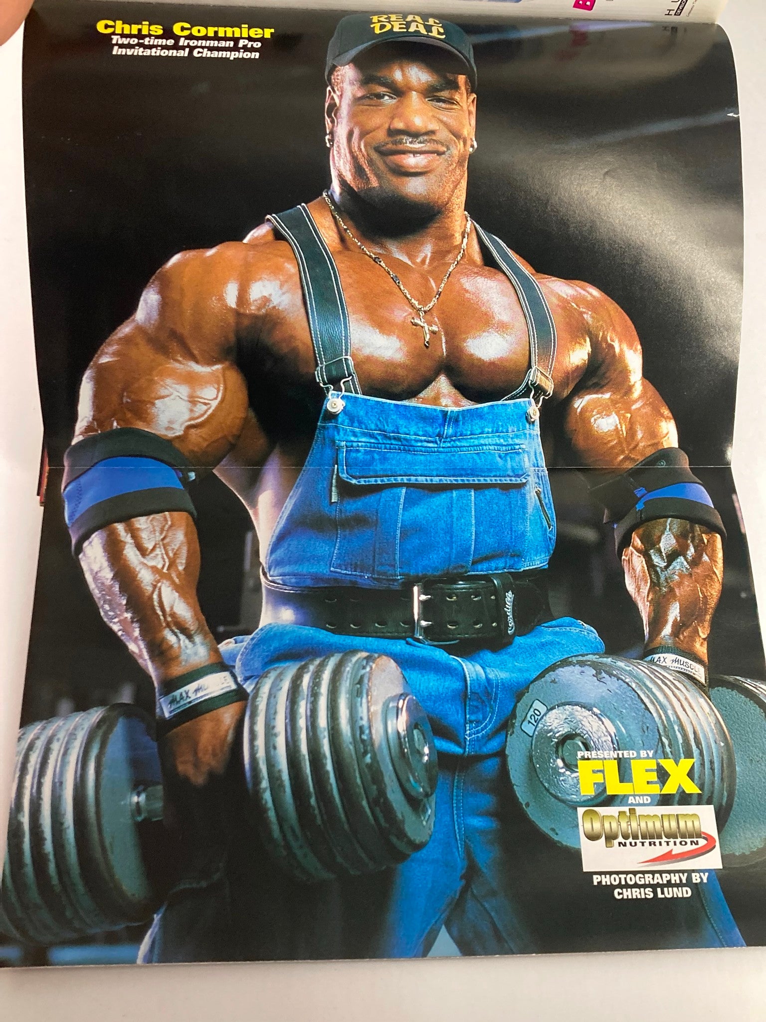 Chris Cormier featured in Flex Magazine June 2000, Vol 18 #4, showcasing his impressive physique while lifting dumbbells, exemplifying strength training in bodybuilding.