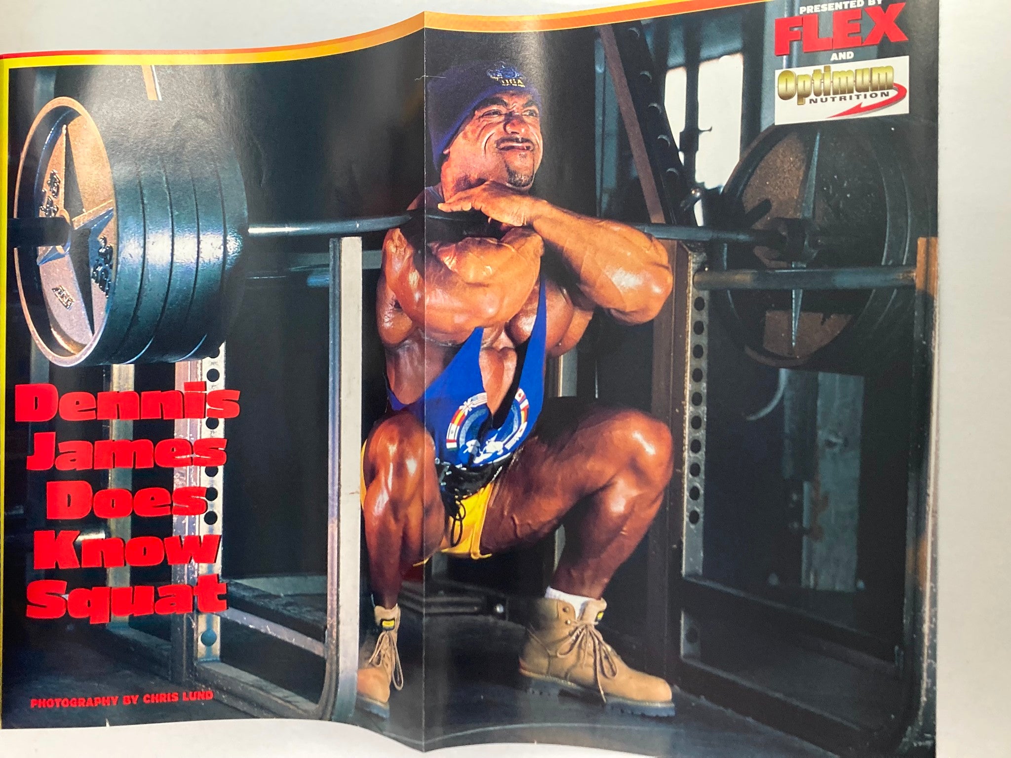 Fold-out poster in Flex Magazine December 2001 Vol 19 #10 showcasing Dennis James performing a squat with impressive weights, highlighting bodybuilding strength and technique.