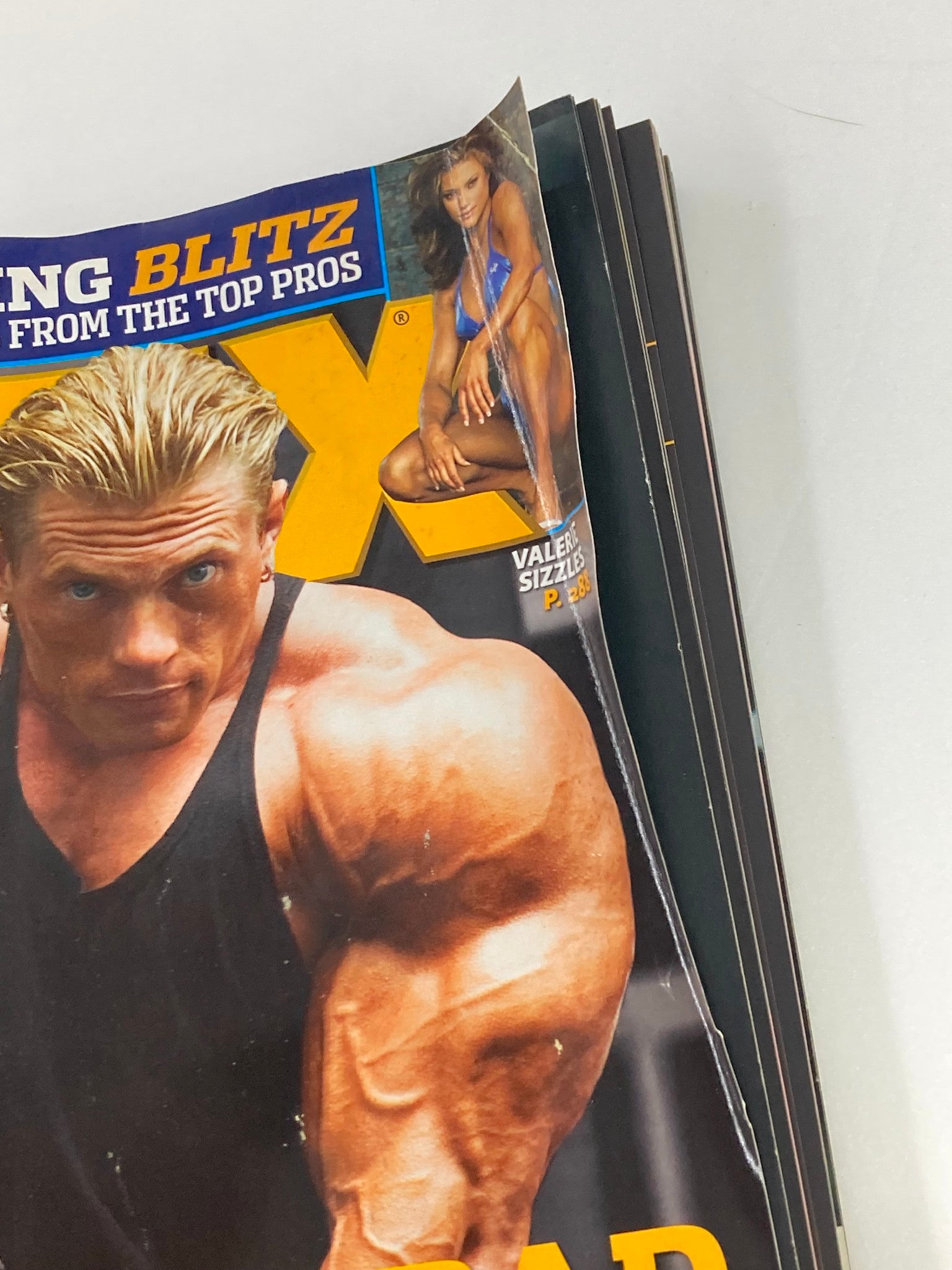 Close-up of the cover of Flex Magazine March 2006 Vol 24 #1 featuring a muscular bodybuilder with long blonde hair, highlighting its vintage appeal for bodybuilding enthusiasts.