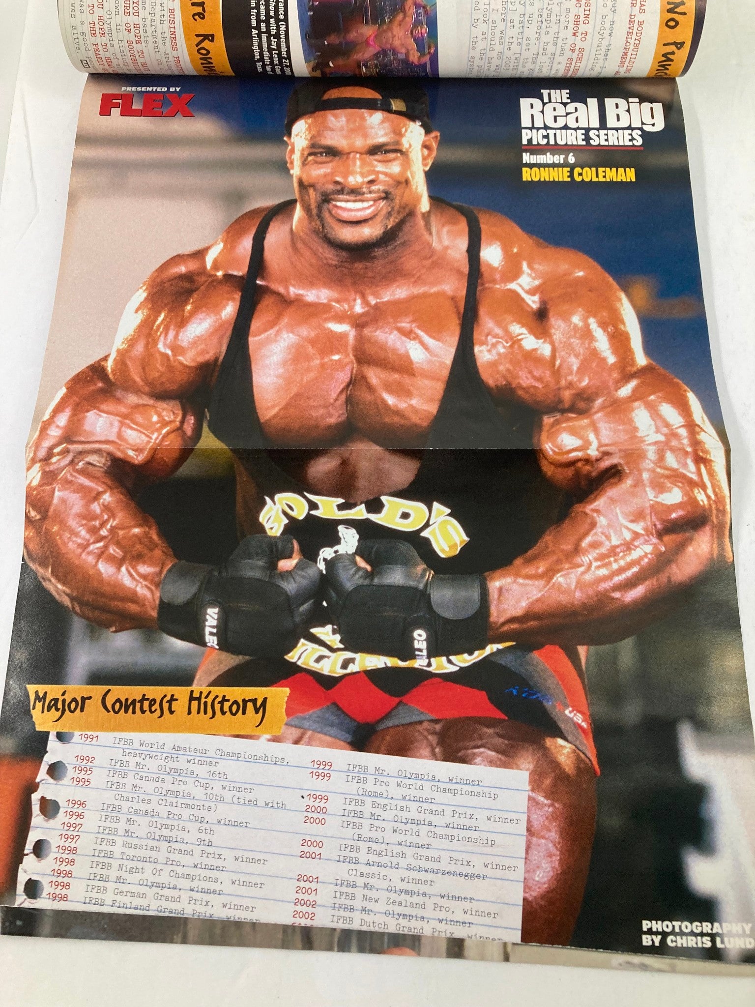 Poster of Ronnie Coleman from Flex Magazine July 2003, Volume 21 Number 5, showcasing his major contest history and impressive physique.