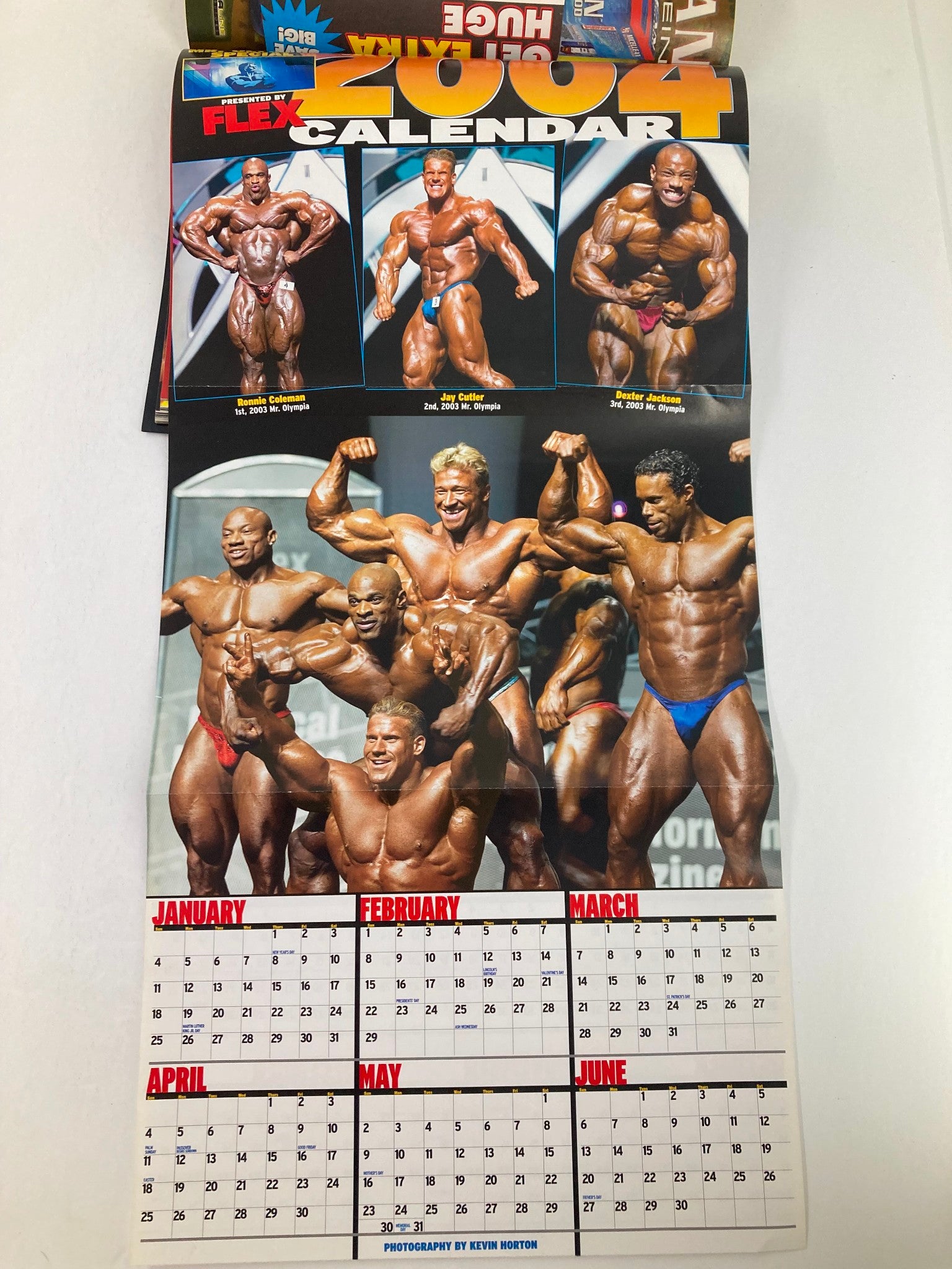 Poster calendar included in the February 2004 issue of Flex Magazine, displaying bodybuilders and fitness events from January to June.