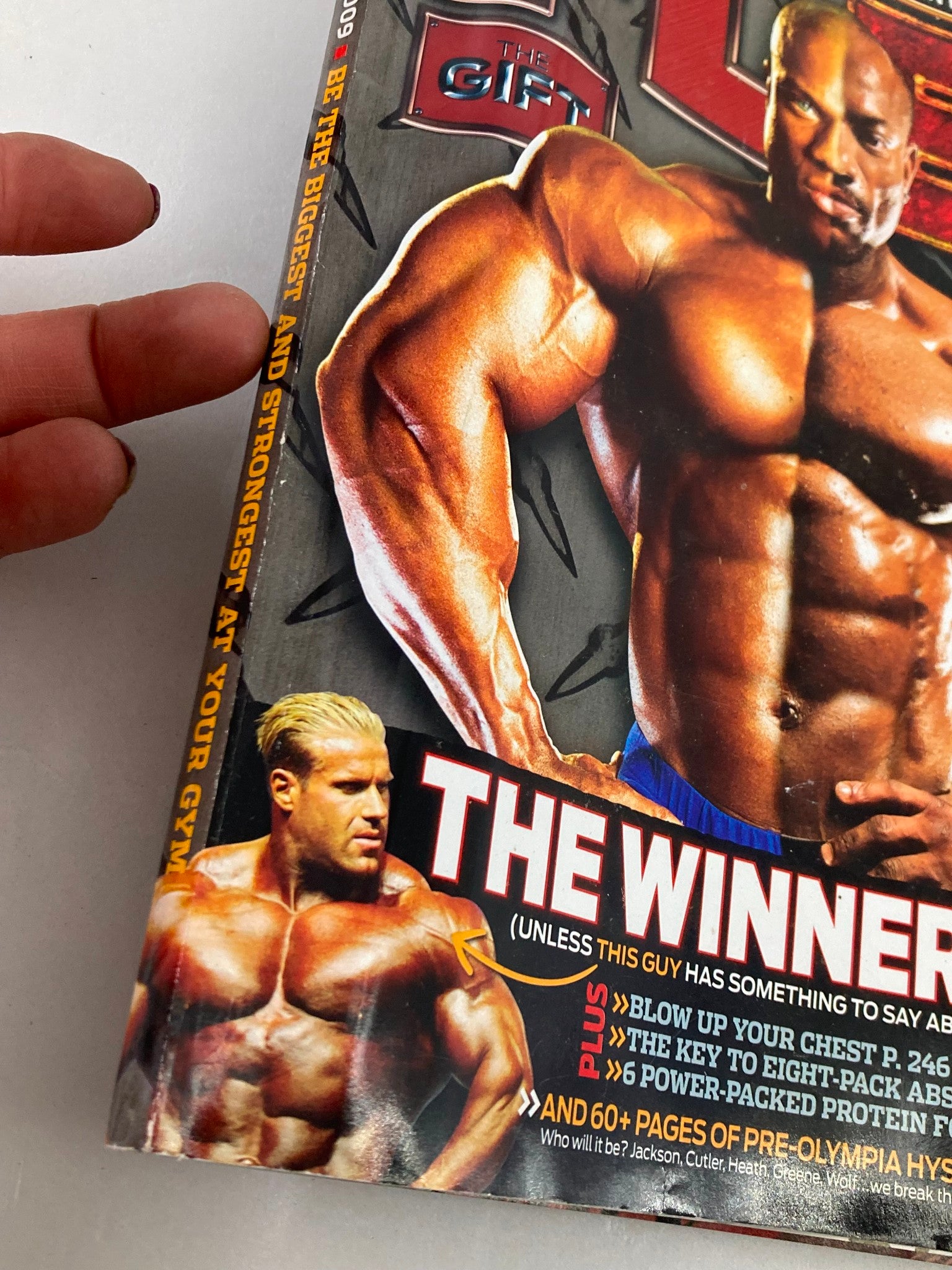 Cover of Flex Magazine October 2009 featuring Phil Heath and Dexter Jackson with a description of bodybuilding victory.