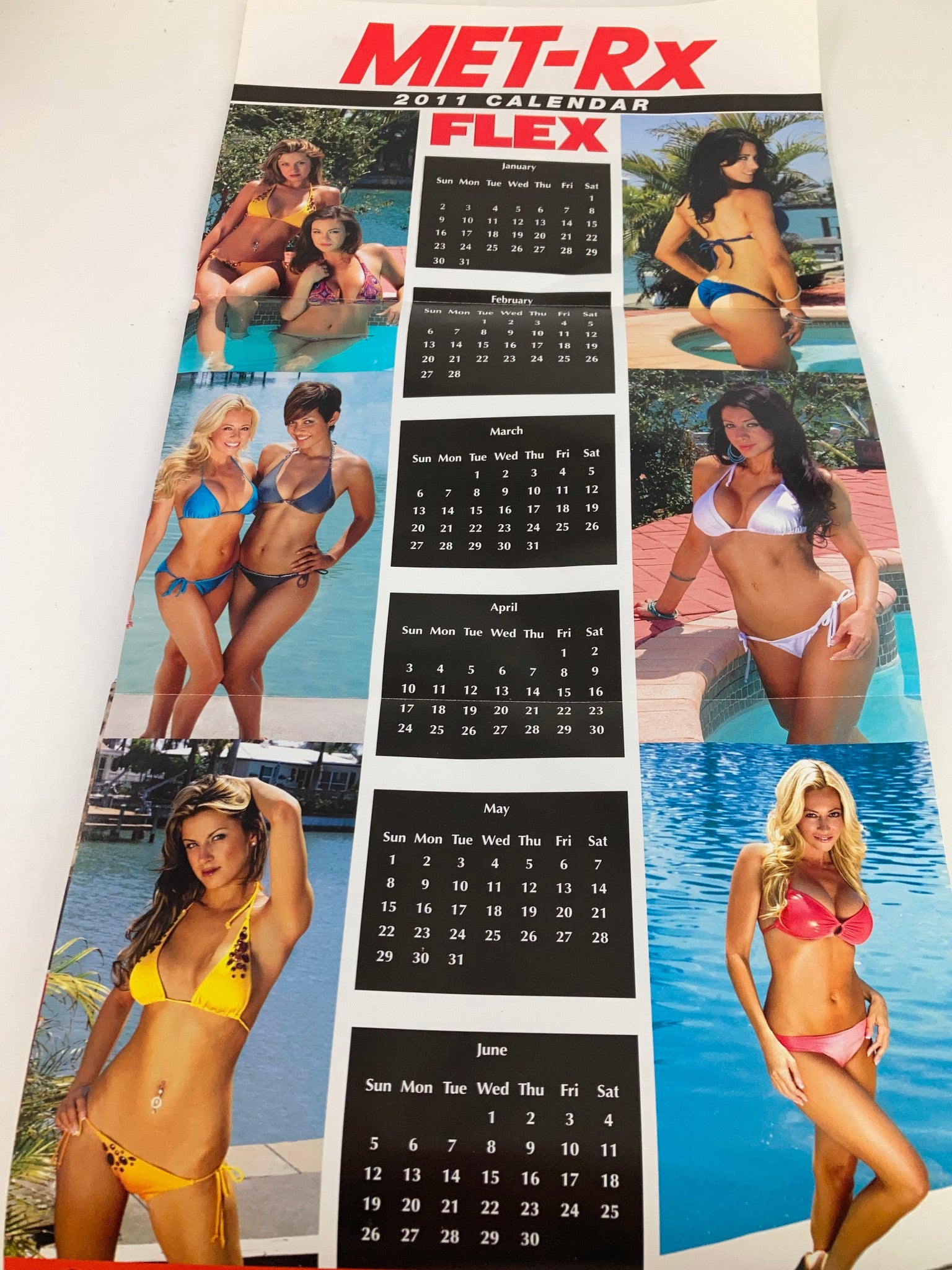 Promotional MET-Rx calendar page from Flex Magazine January 2011 featuring models in swimwear.