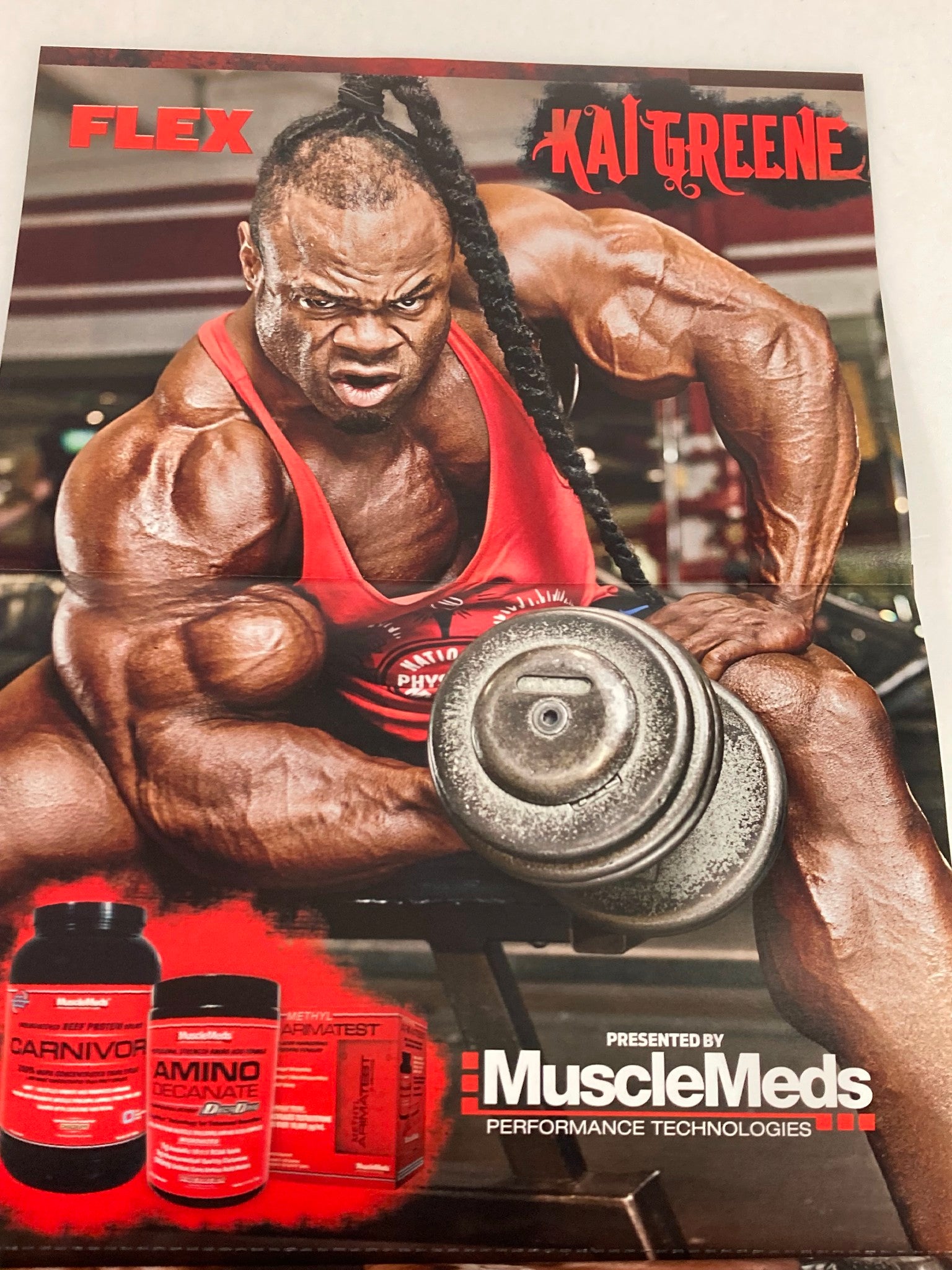 Cover of Flex Magazine May 2012 featuring bodybuilding icon Kai Greene in an intense workout pose, showcasing his impressive physique and strength, presented by MuscleMeds.