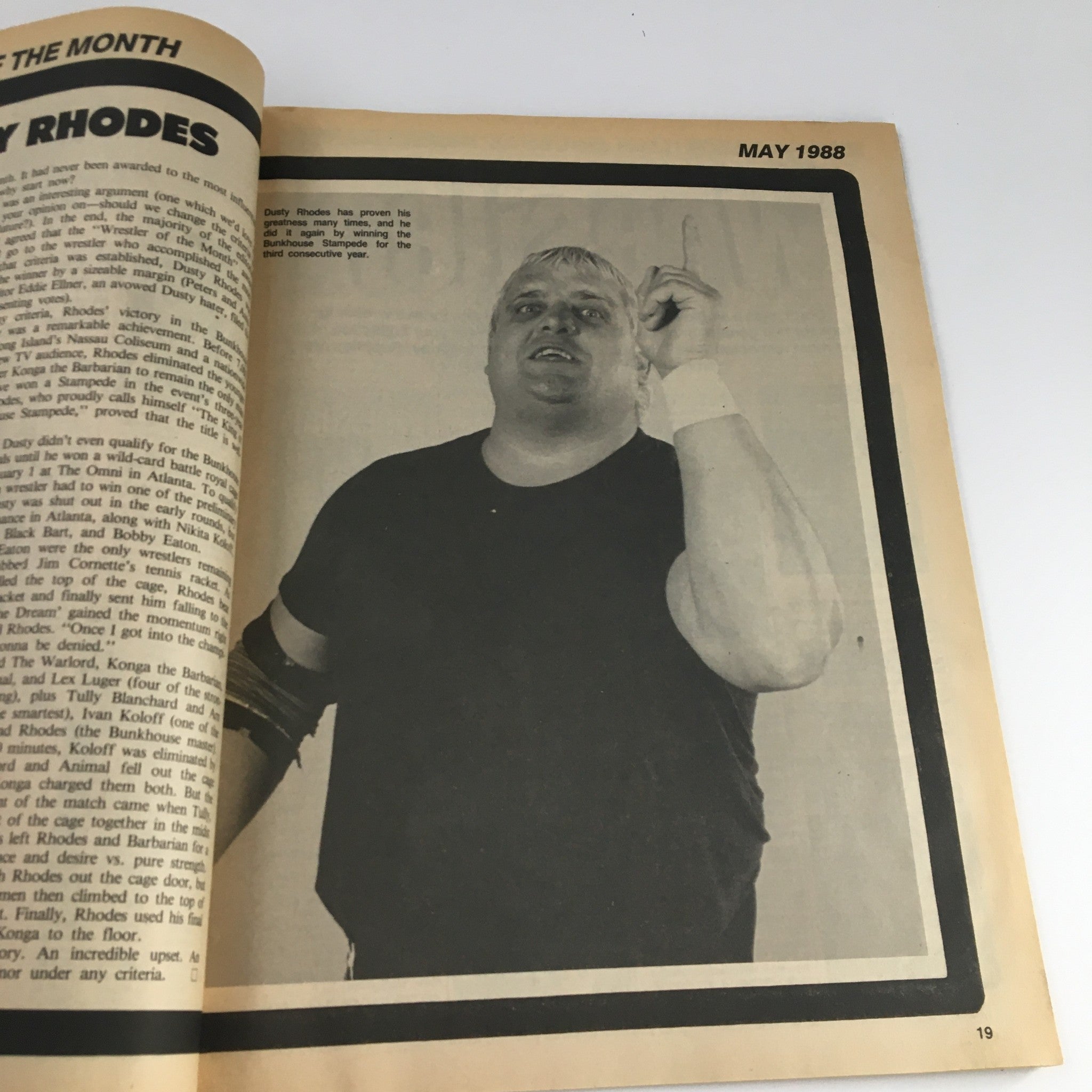 Page from Sports Review Wrestling Magazine May 1988 highlighting Dusty Rhodes as Wrestler of the Month, showcasing a photo and details about his achievements.