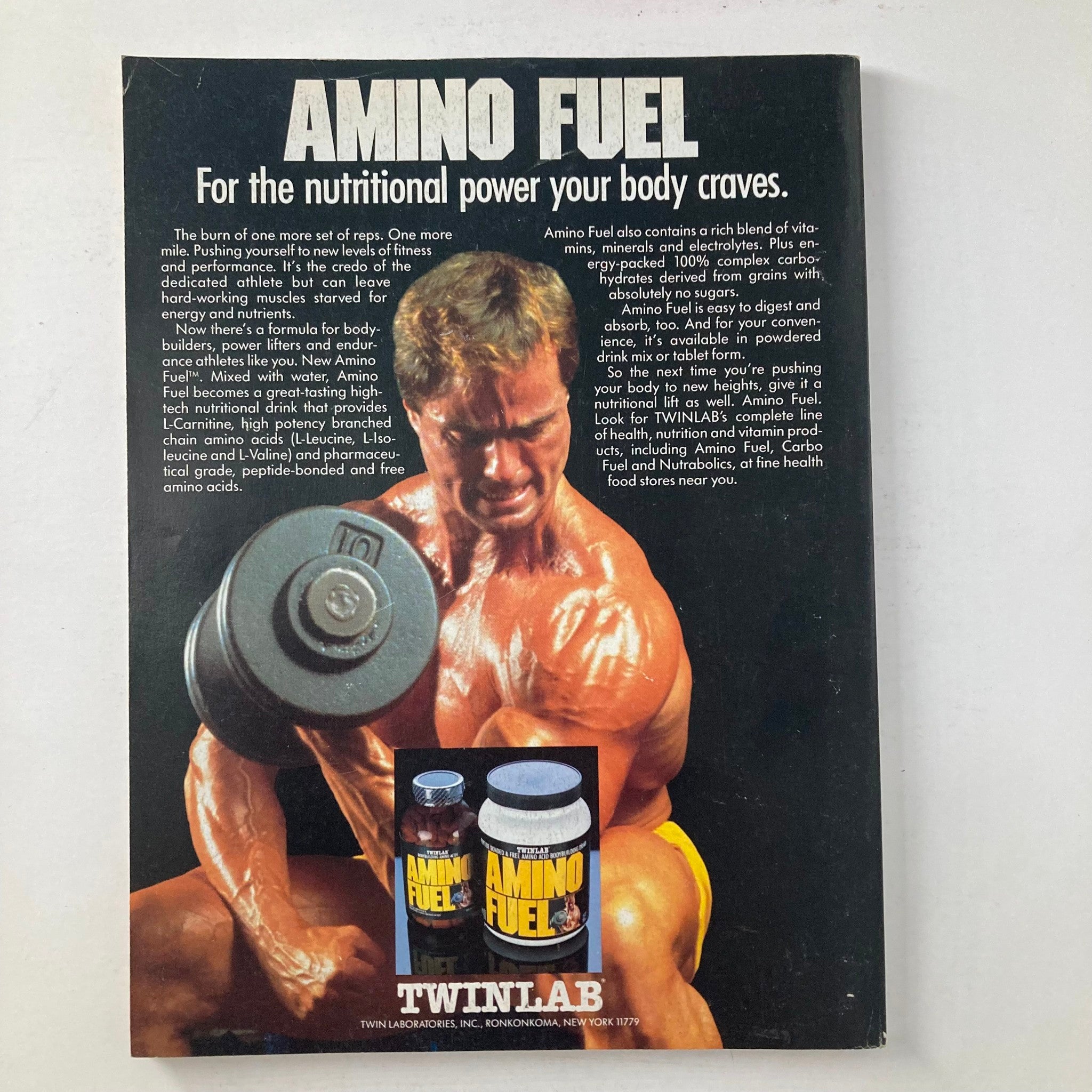 Back cover of Joe Weider's Muscle & Fitness Magazine October 1987, showcasing an advertisement for Amino Fuel with a bodybuilder lifting weights.
