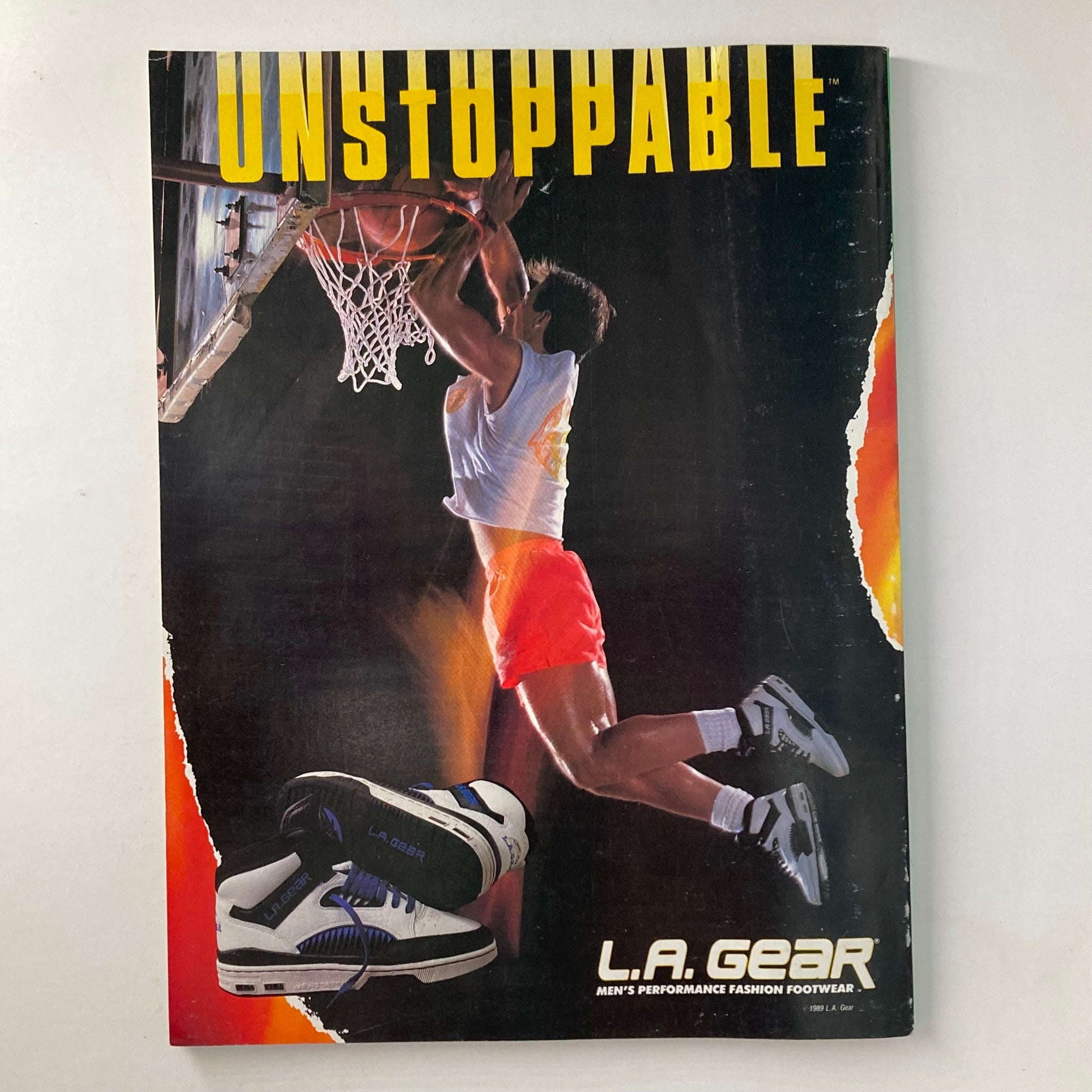 Back cover of promotional magazine featuring a basketball player, with the tagline 'Unstoppable' for L.A. Gear men's performance fashion footwear.