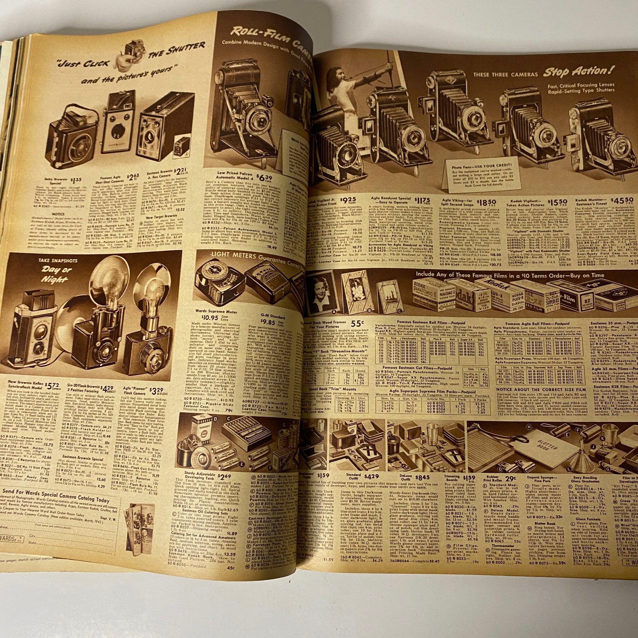 Interior page of the 1942 Montgomery Ward Spring and Summer Catalog displaying a range of cameras and photography equipment.