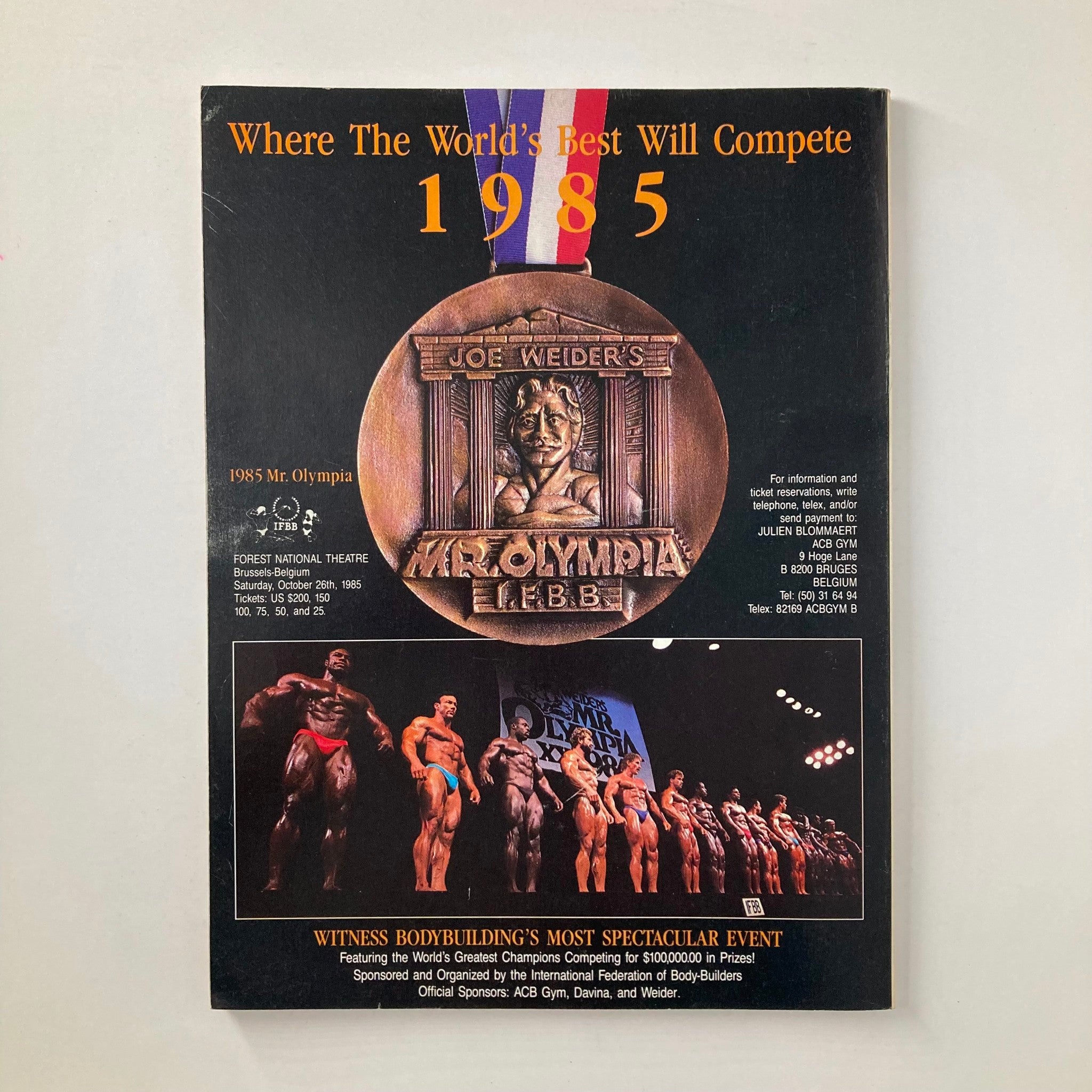 Back cover of Muscle & Fitness Magazine May 1985 featuring details about the 1985 Mr. Olympia competition. Highlights include event information, ticket prices, and promotional images of bodybuilders competing. The design showcases the prestigious Joe Weider's Mr. Olympia medallion.