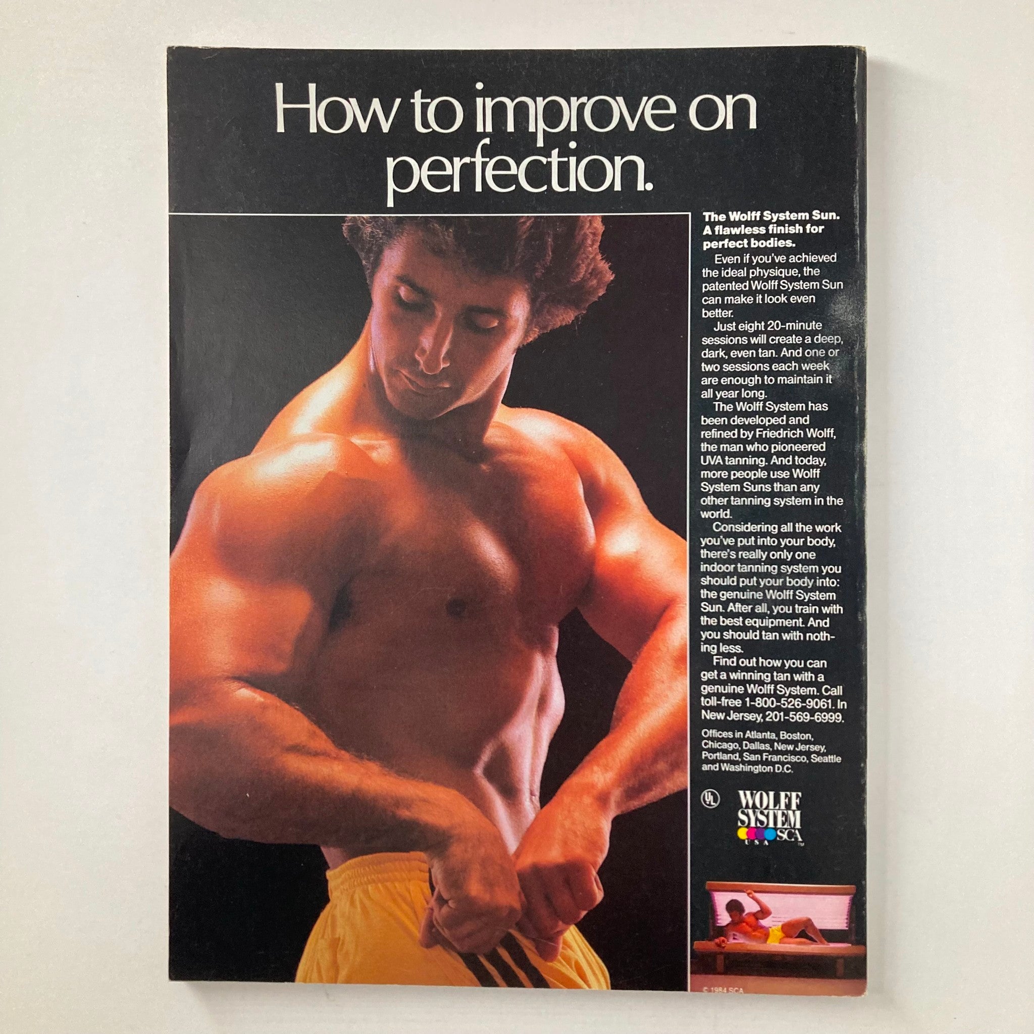 Back cover of Joe Weider's Muscle & Fitness Magazine April 1985, featuring the promotion of the Wolff System Sun products for achieving flawless looking skin after workouts.