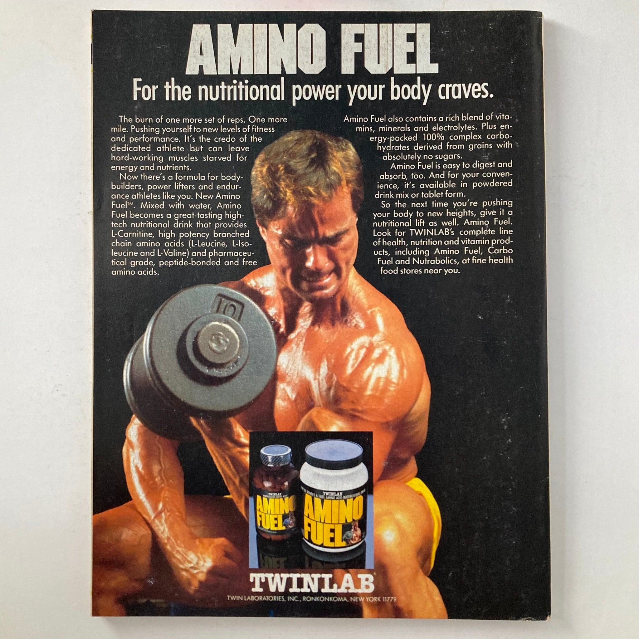 Back cover of Joe Weider's Muscle & Fitness Magazine August 1987 advertising Amino Fuel, a nutritional supplement for bodybuilders, showcasing a muscular athlete with a dumbbell, emphasizing fitness and strength.
