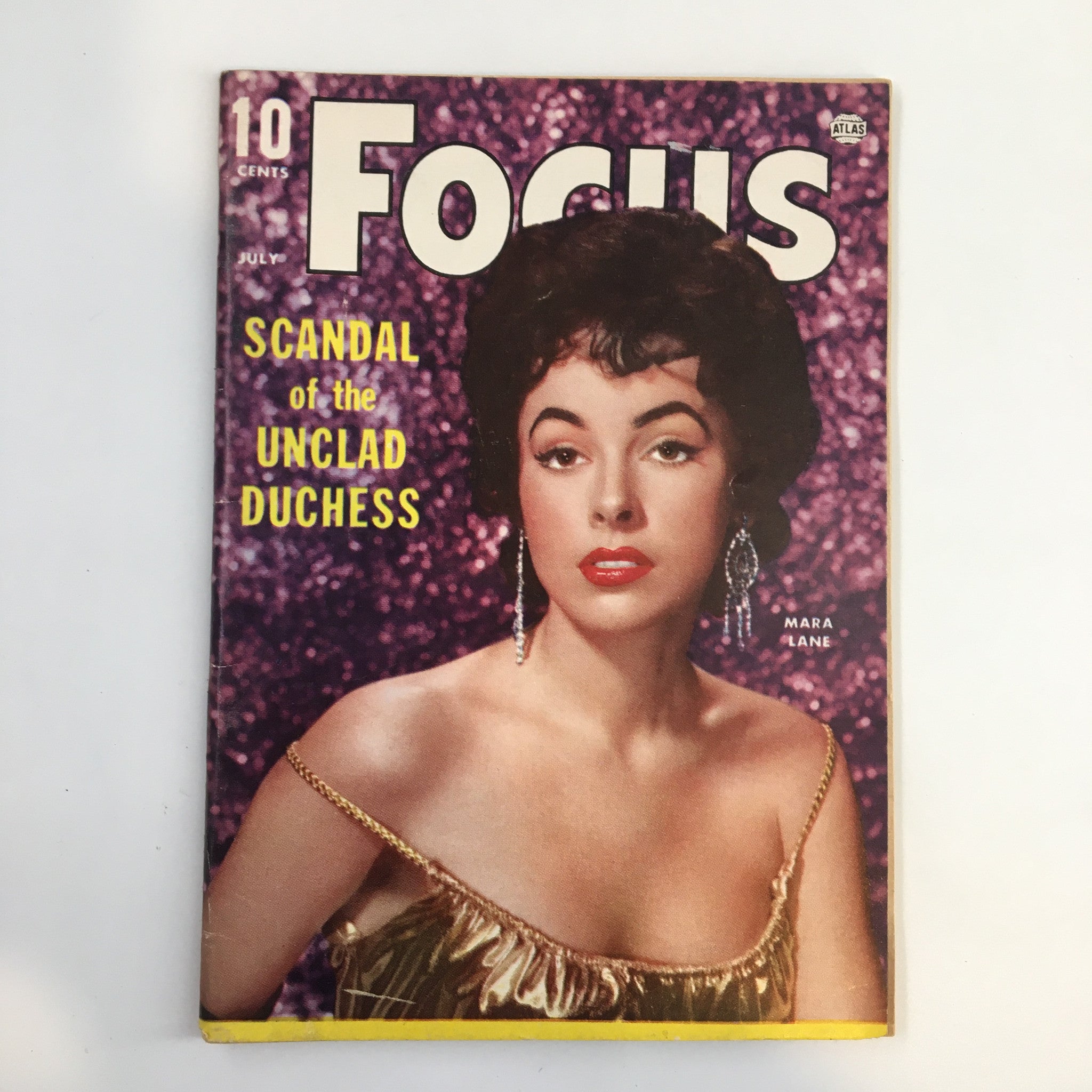 VTG Focus Magazine July 1955 featuring the article 'Mara Lane: Scandal of the Unclad Duchess' on the cover, showcasing a glamorous portrait of a woman against a sparkling purple background.