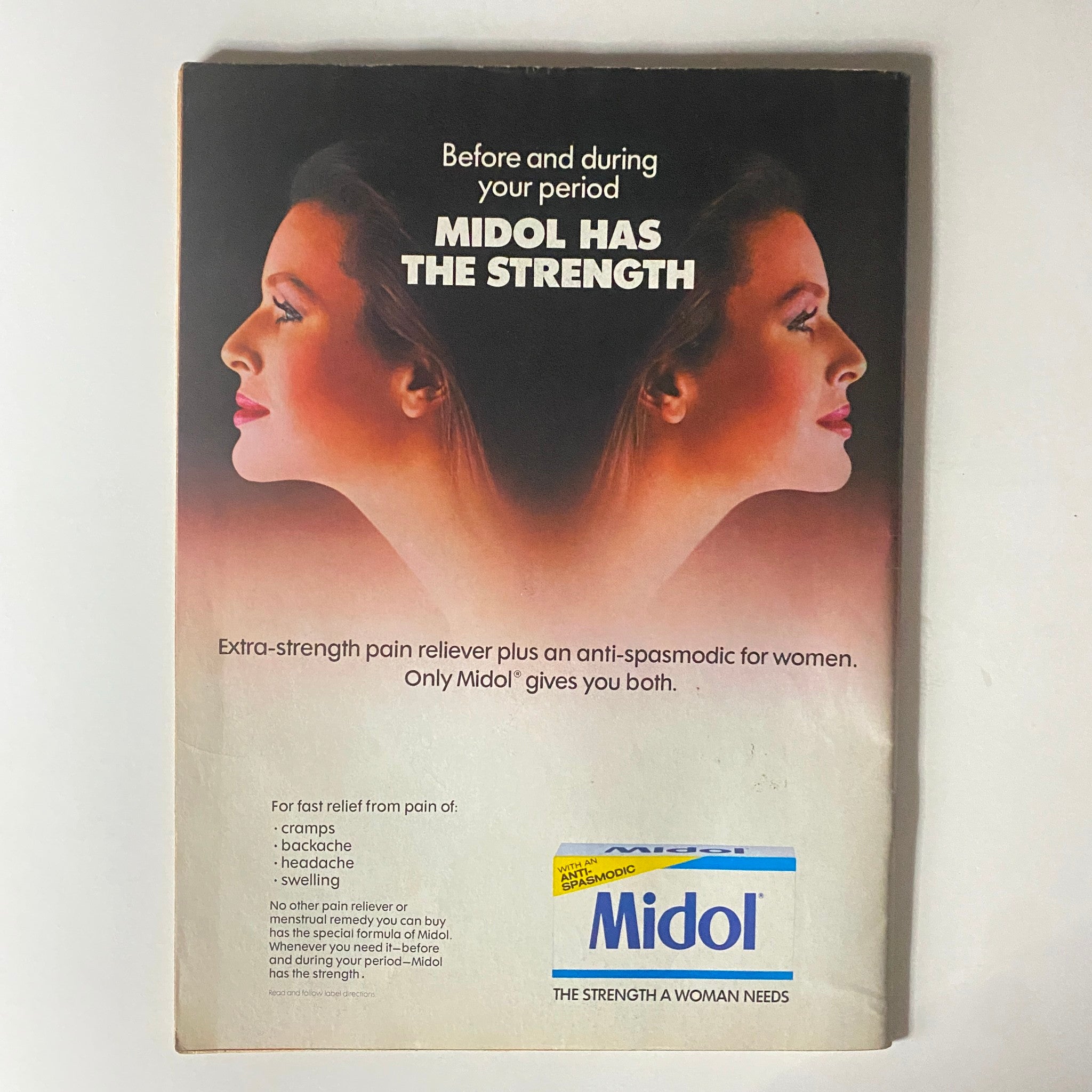 Midol advertisement featuring two profiles of women with the slogan 'Before and during your period Midol has the strength'. This vintage ad promotes Midol as an extra-strength pain reliever and anti-spasmodic specifically for women, highlighting its effectiveness for cramps, backaches, headaches, and swelling. The ad is part of the nostalgic 1980s pop culture, similar to the Tiger Beat Star Magazine from September 1982 featuring John Stamos.