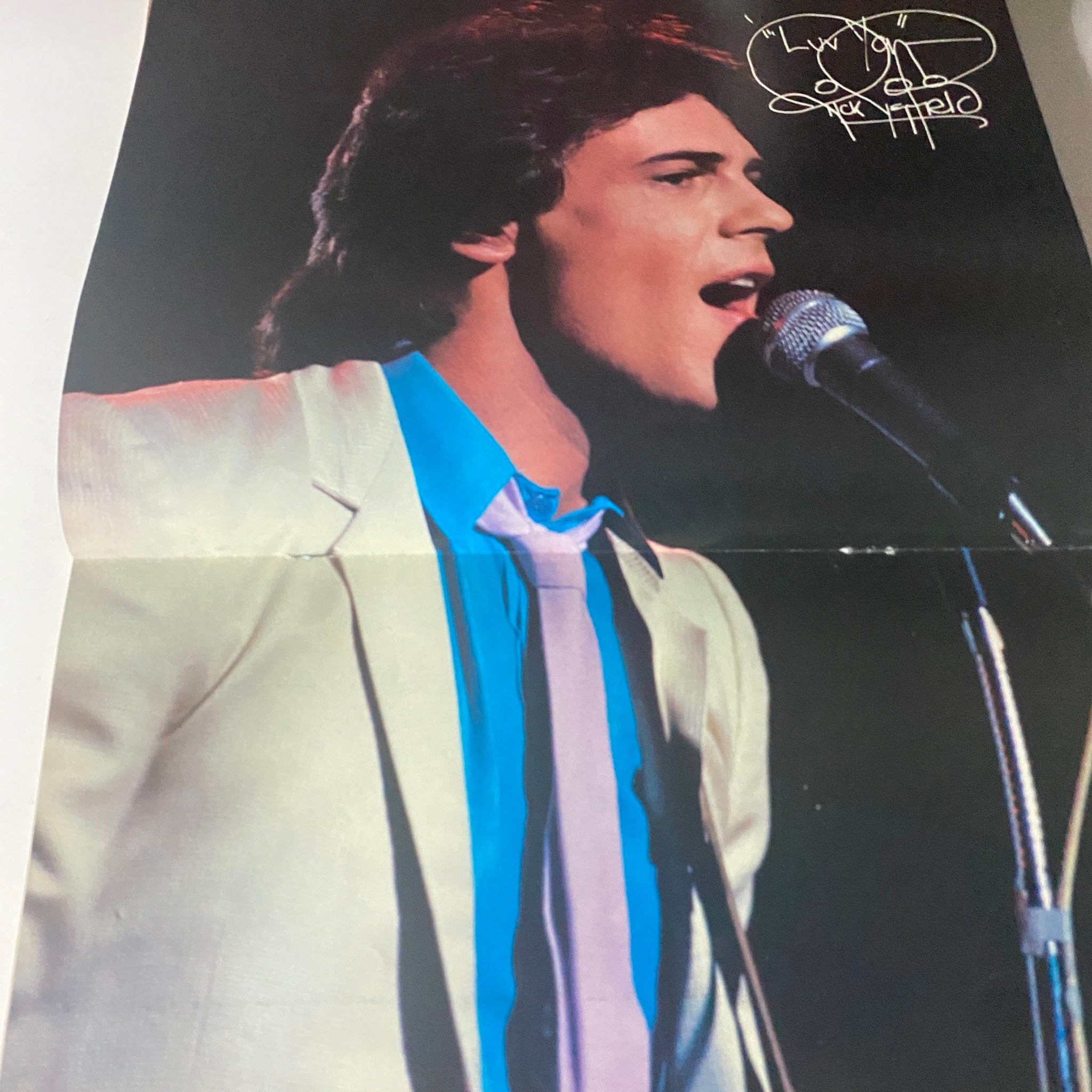 Promotional image of a male singer in a white suit, featured in Tiger Beat Star Magazine June 1982, highlighting 80s fashion and music culture.