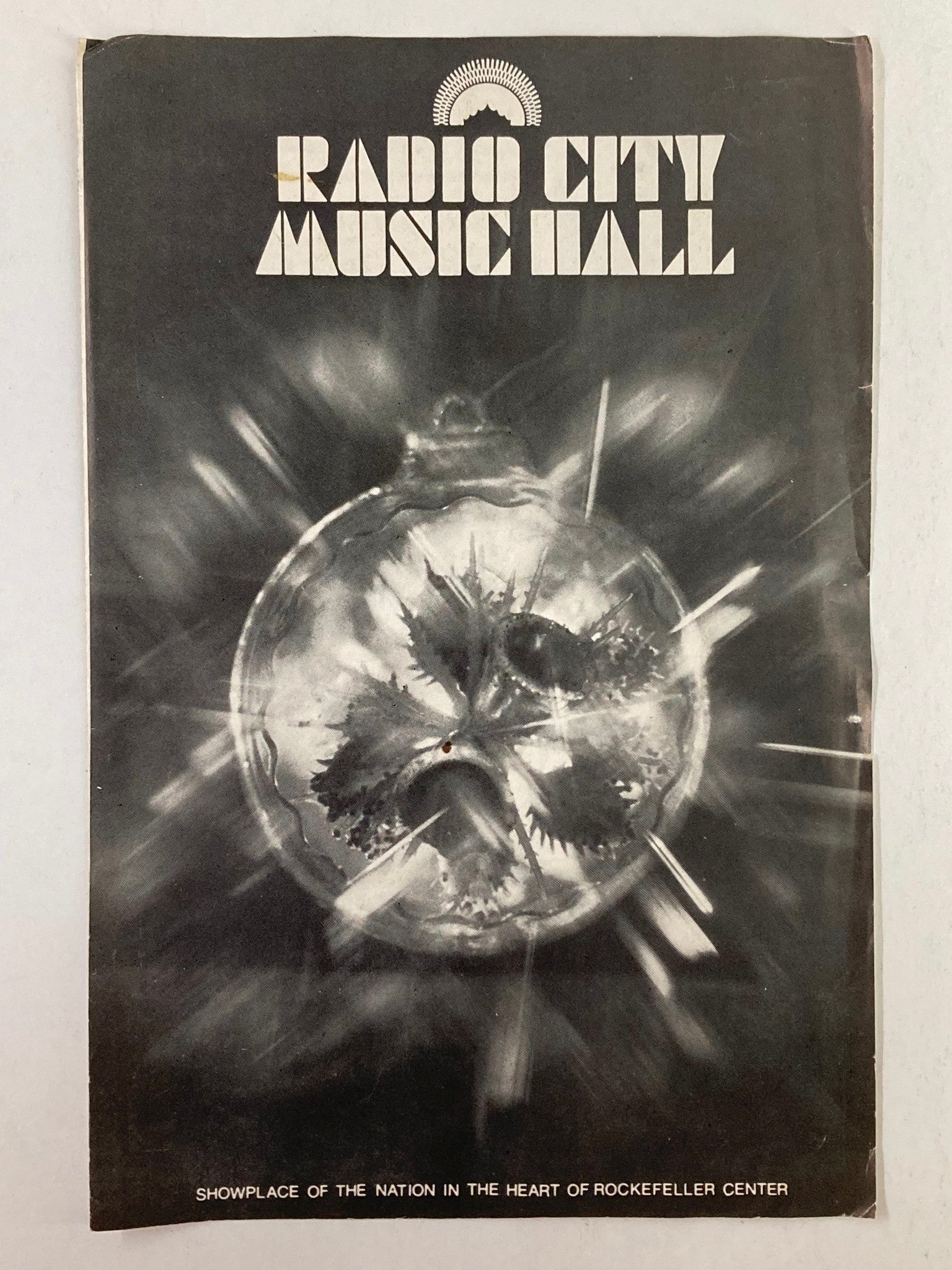 1977 Radio City Hall Program cover featuring an artistic black and white design for the show, showcasing Helen Reddy and Sean Marshall in Pete's Dragon.