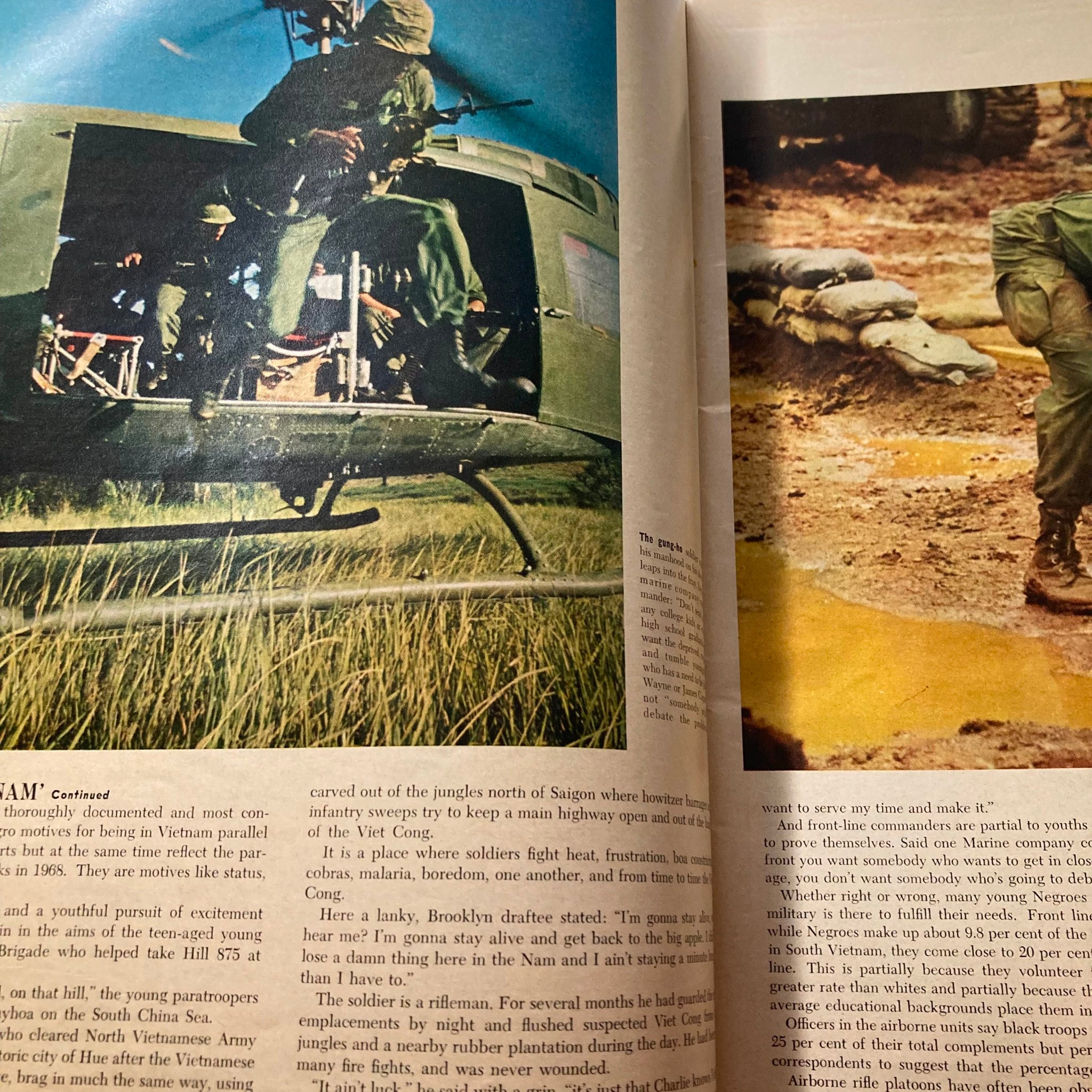 Action shot from VTG Ebony Magazine August 1968 Vol 23 No. 10 The Black Soldier Special Issue, depicting soldiers engaged in military operations during the Vietnam War.