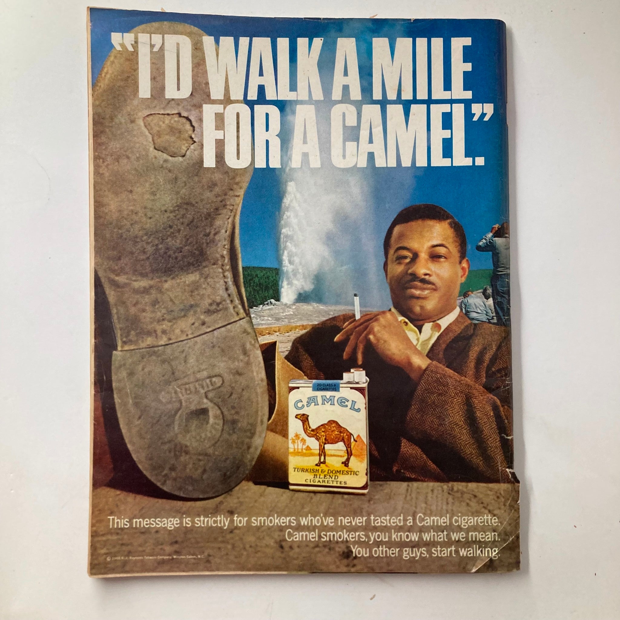 Back cover of VTG Ebony Magazine August 1968, Vol 23 No. 10 The Black Soldier Special Issue featuring a Camel cigarette advertisement with a man in a brown suit and the tagline about walking a mile for a Camel.