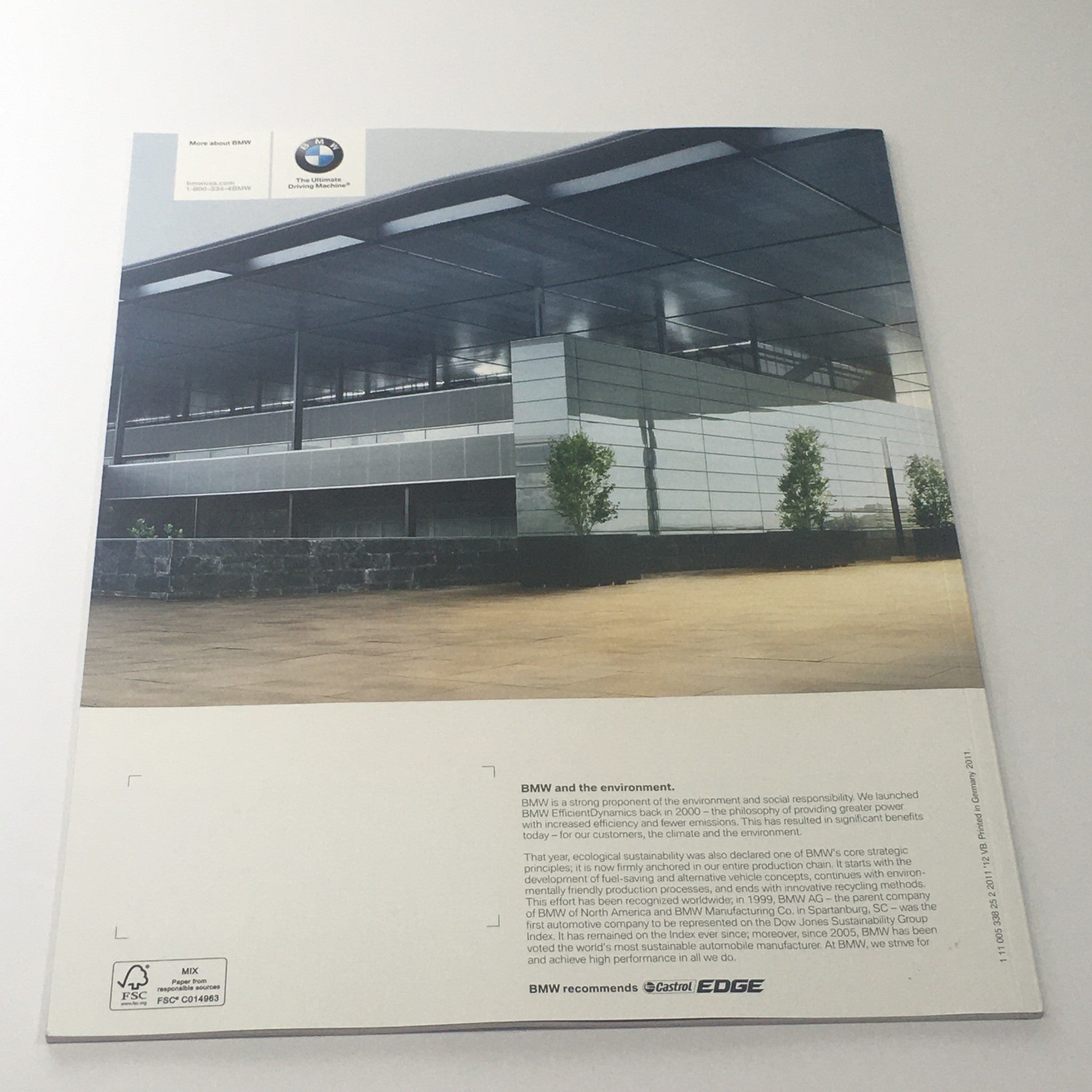 Cover of the 2012 BMW 5 Series Sedan 528i 535i 550i X-D Dealership Car Auto Brochure Catalog featuring a modern architectural background.