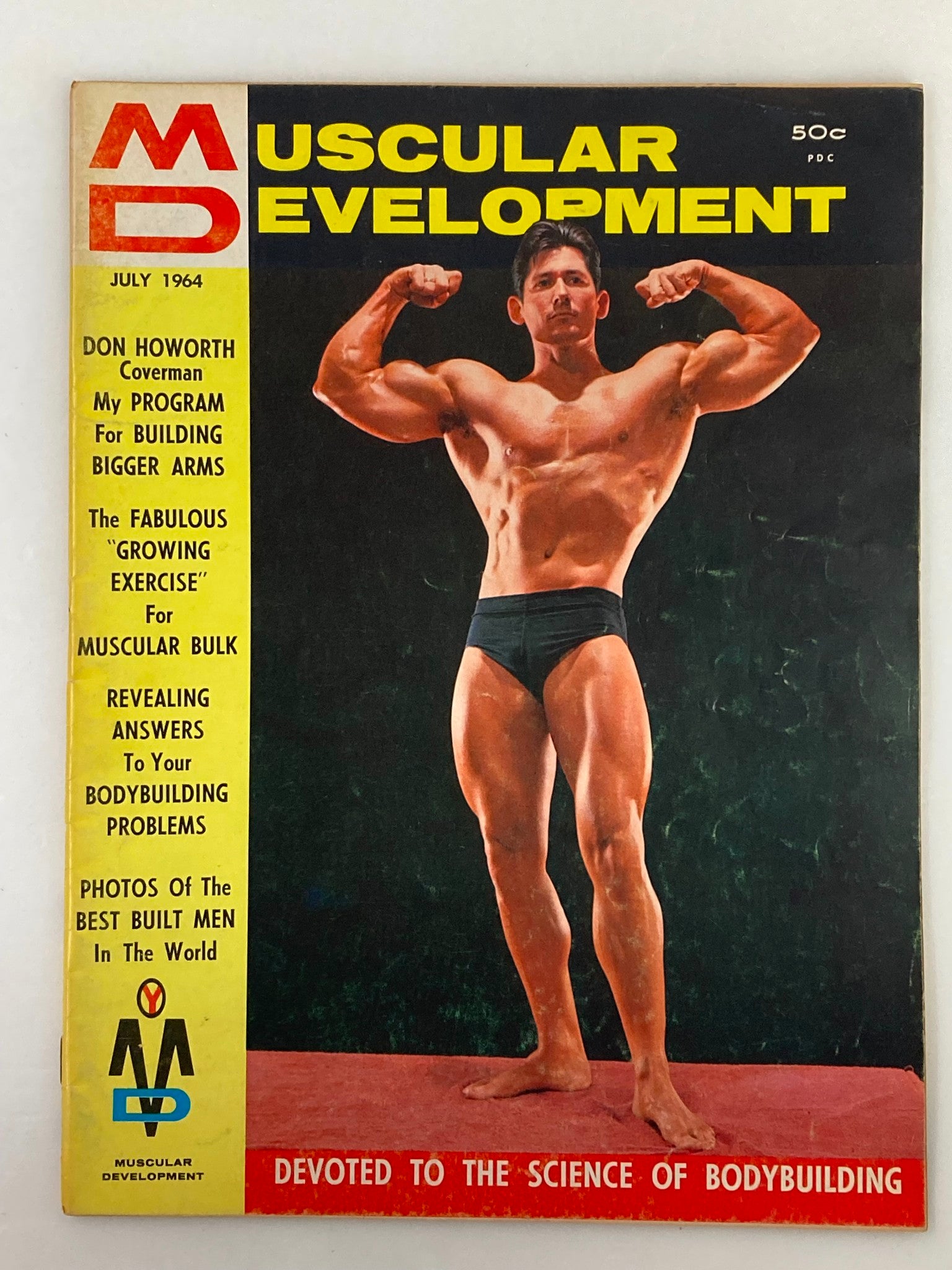 Cover of VTG Muscular Development Magazine July 1964, Volume 1, Issue 7, featuring bodybuilder Don Howorth posing in muscular stance.