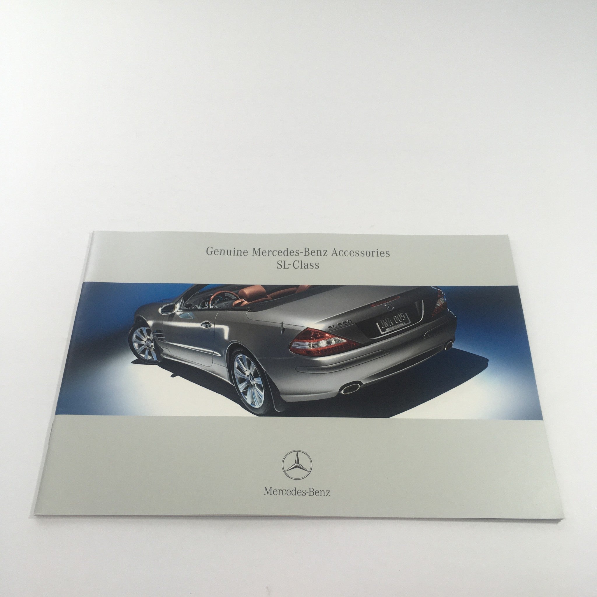 2006 Mercedes-Benz SL-Class Accessories dealership brochure showcasing a silver SL-Class model, highlighting its design and luxury features.